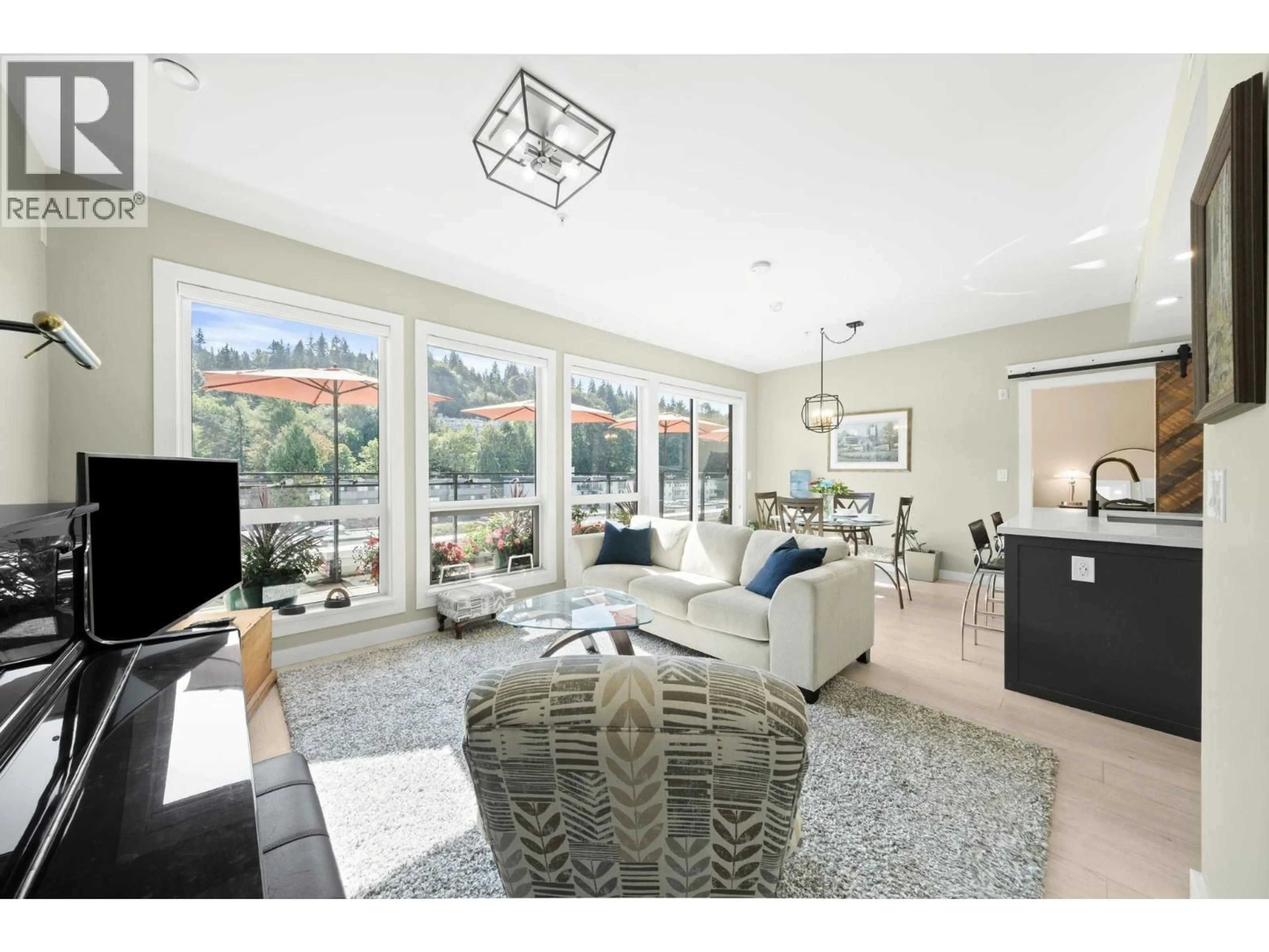 Living room with furniture, ceramic/tile floor for 605 - 3038 ST GEORGE STREET, Port Moody British Columbia V3H0L3