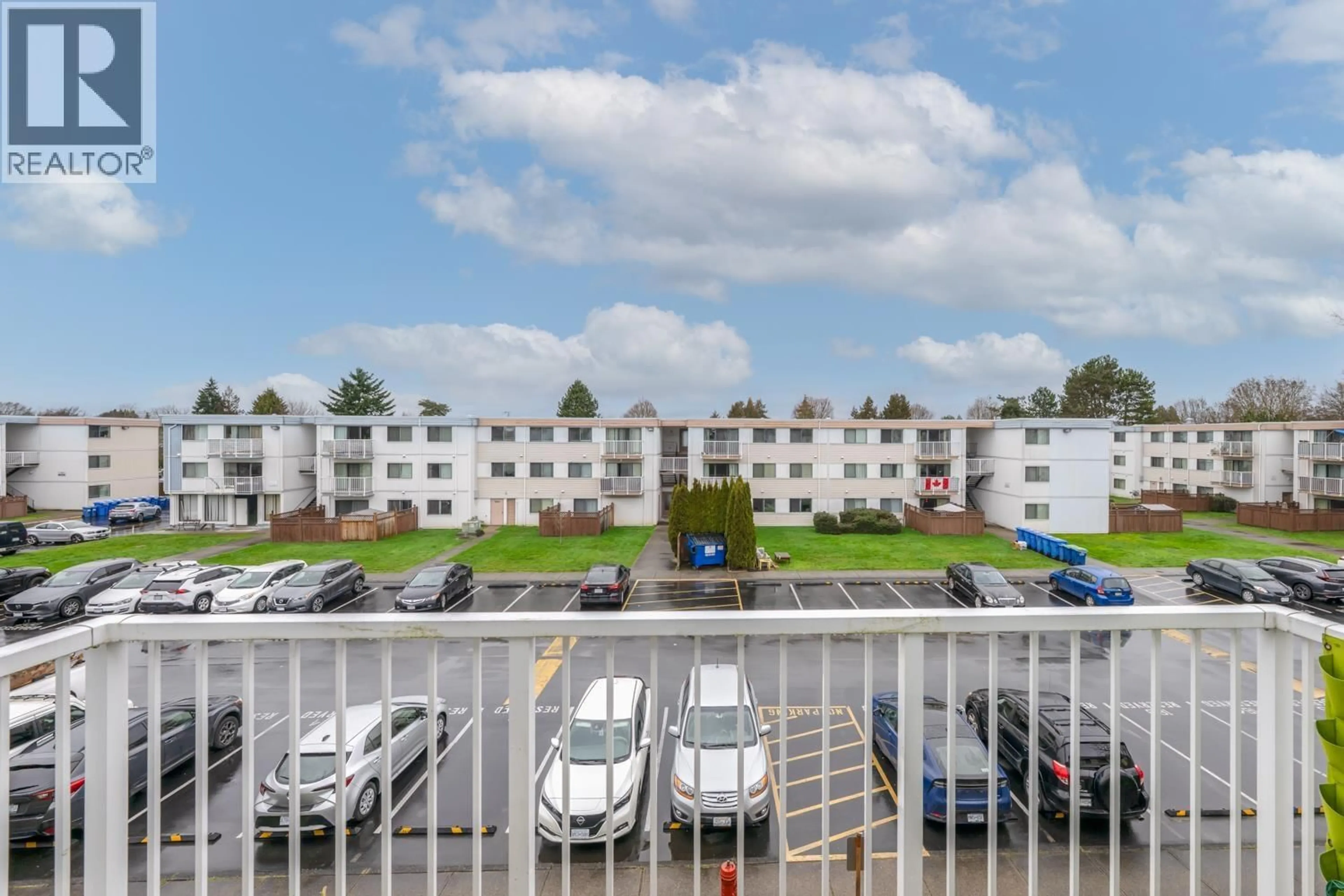 Patio, city buildings view from balcony for 310 - 7240 LINDSAY ROAD, Richmond British Columbia V7C3M6