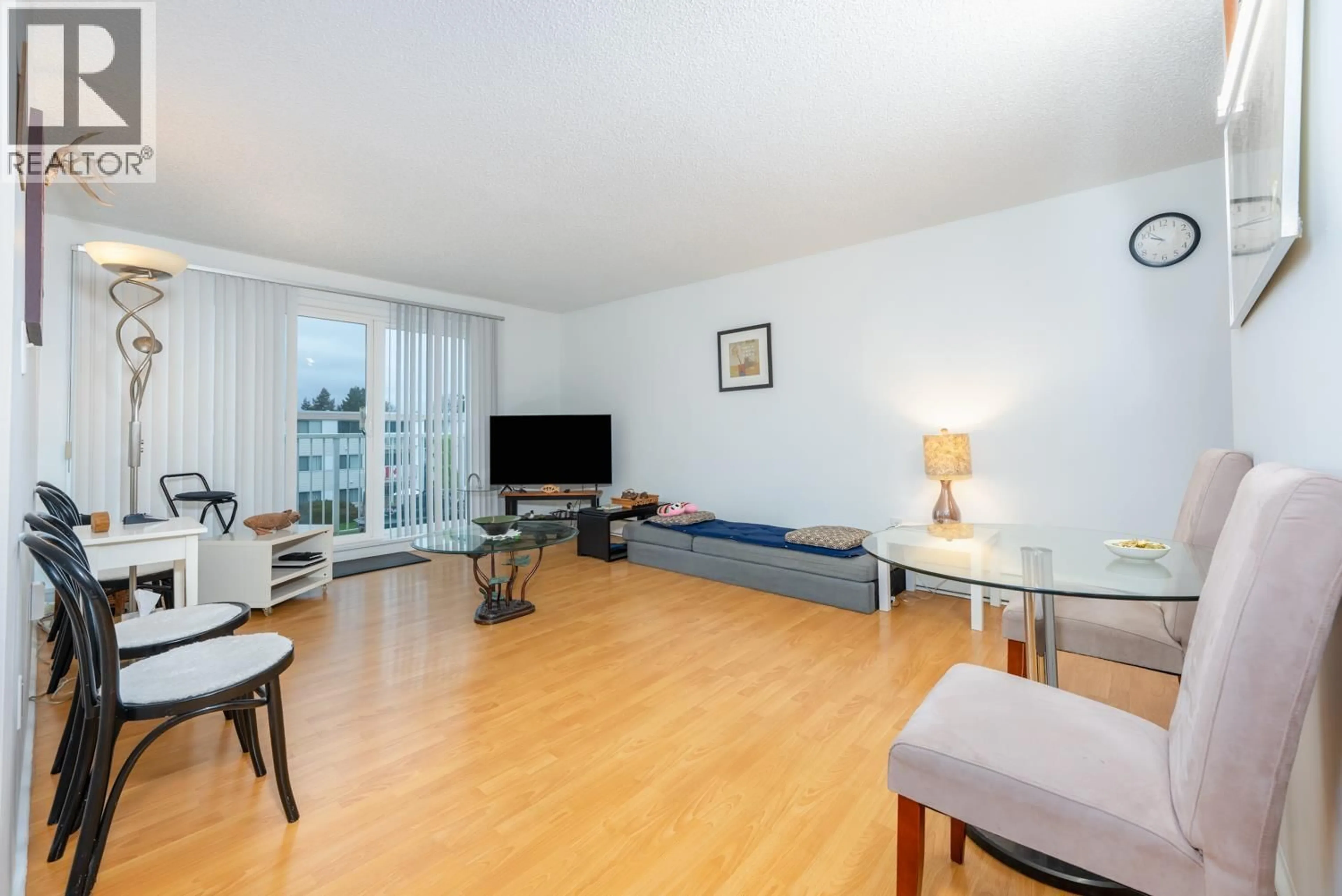 Living room with furniture, wood/laminate floor for 310 - 7240 LINDSAY ROAD, Richmond British Columbia V7C3M6