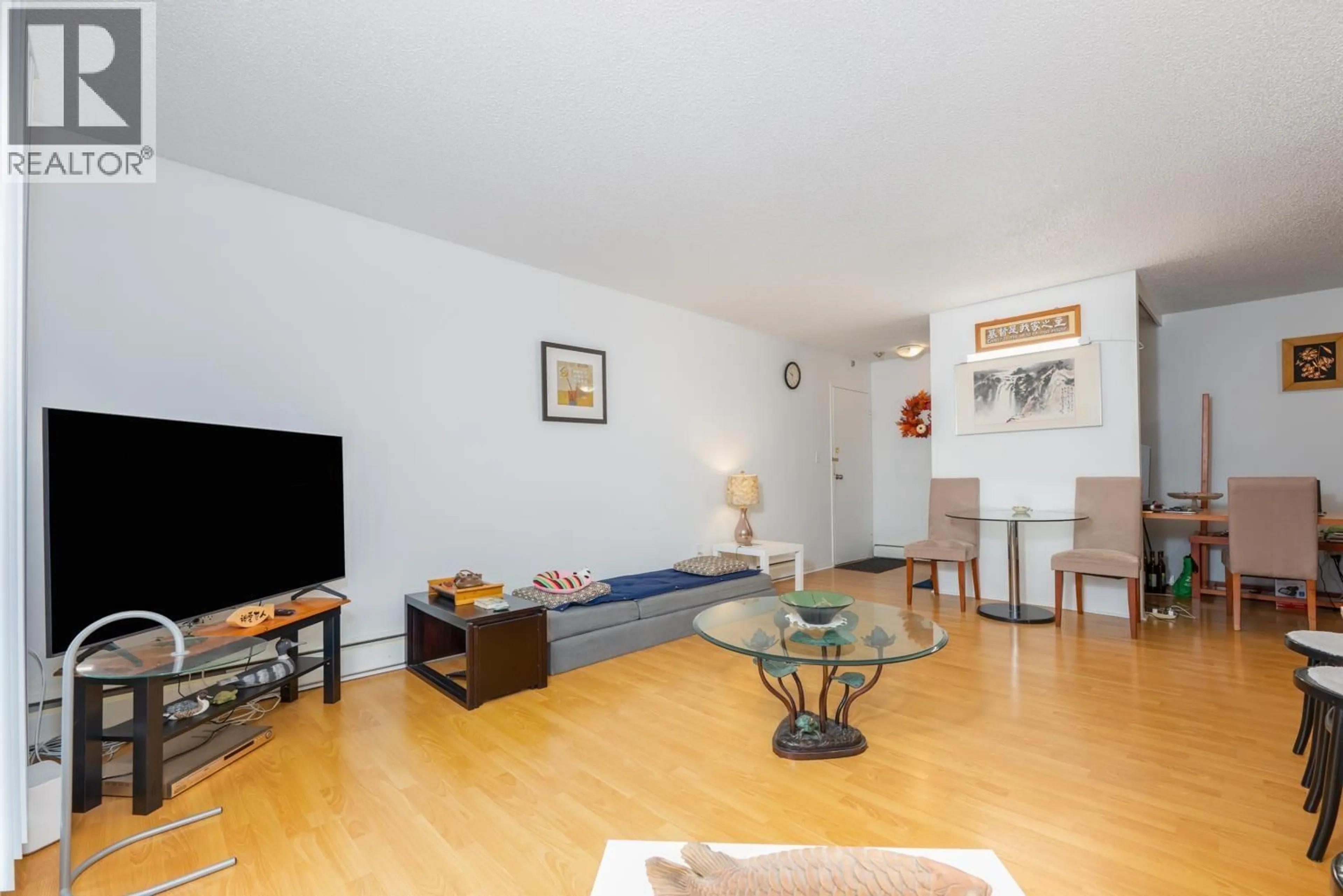 Living room with furniture, wood/laminate floor for 310 - 7240 LINDSAY ROAD, Richmond British Columbia V7C3M6