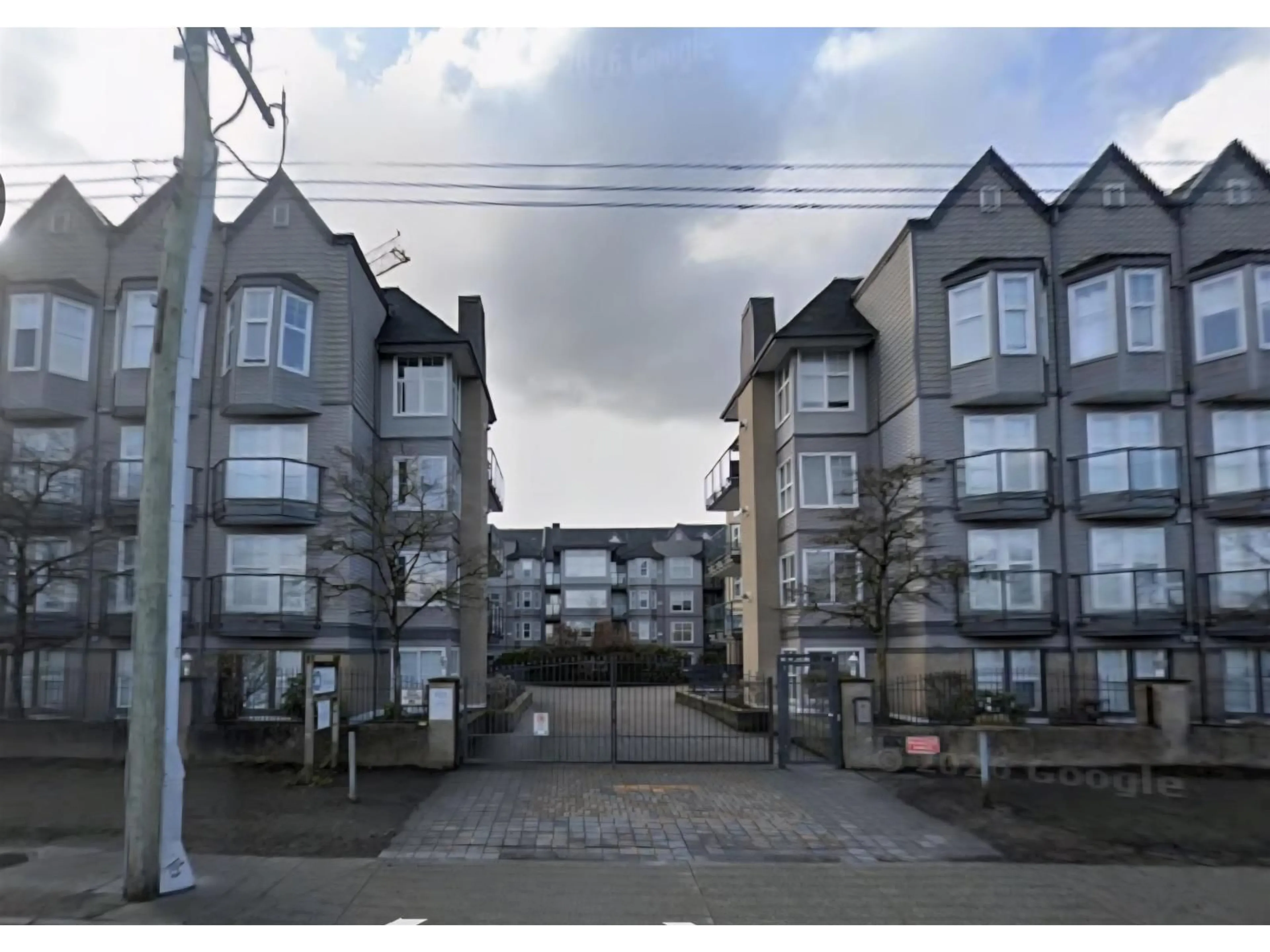 A pic from outside/outdoor area/front of a property/back of a property/a pic from drone, street for 310 - 20200 56 AVENUE, Langley British Columbia V3A8S1