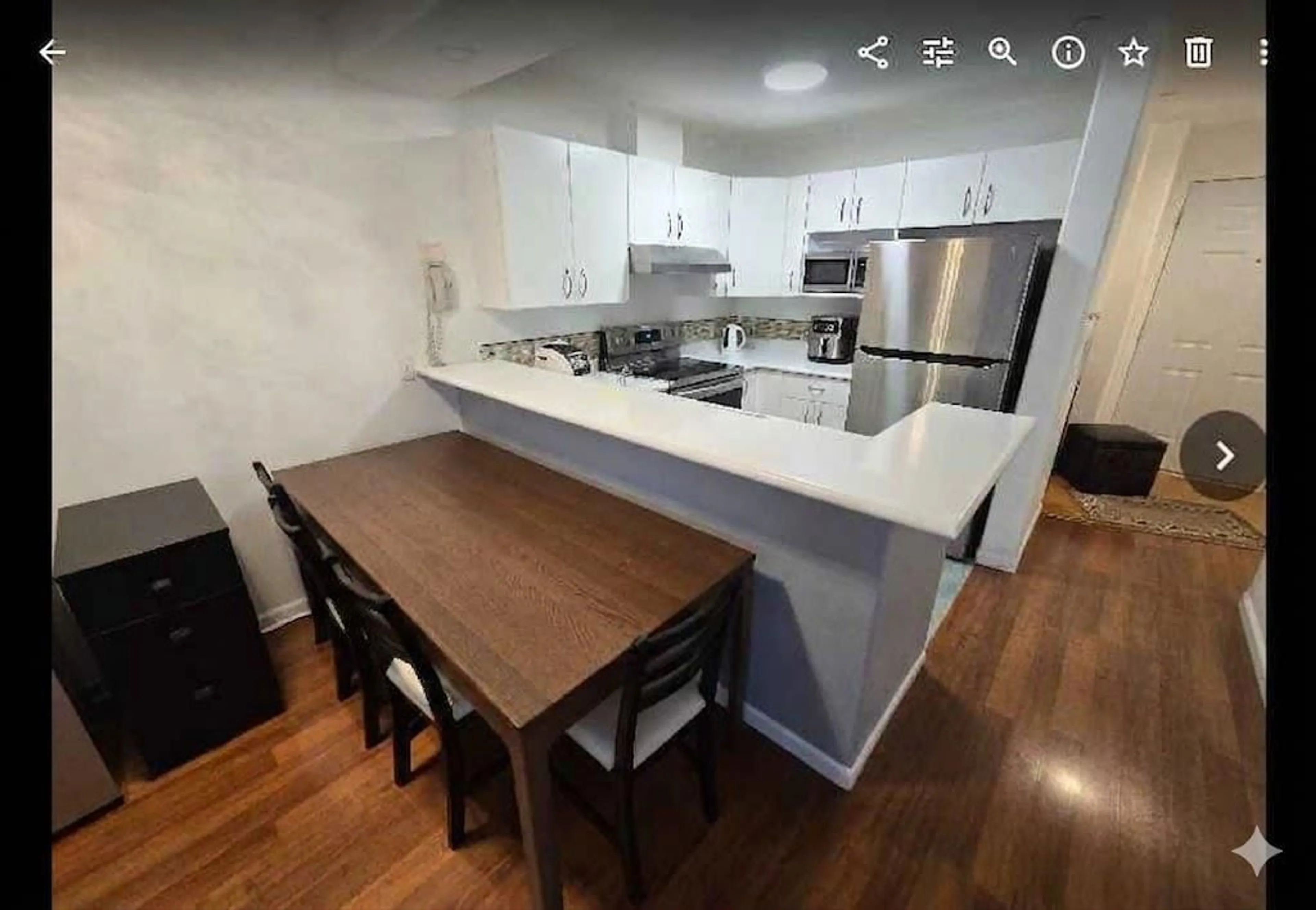 Open concept kitchen, wood/laminate floor for 310 - 20200 56 AVENUE, Langley British Columbia V3A8S1