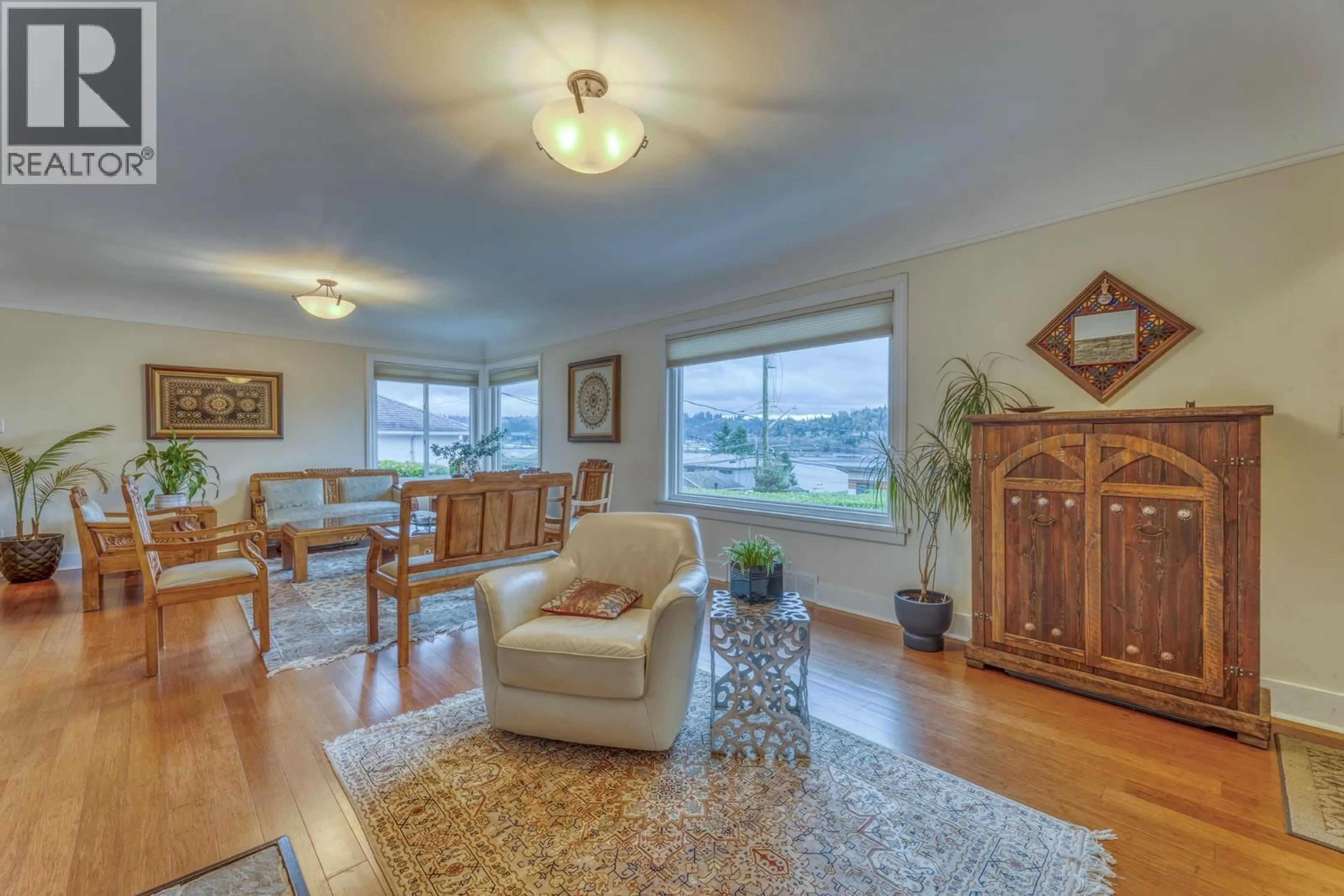 Living room with furniture, wood/laminate floor for 1227 IOCO ROAD, Port Moody British Columbia V3H2W9