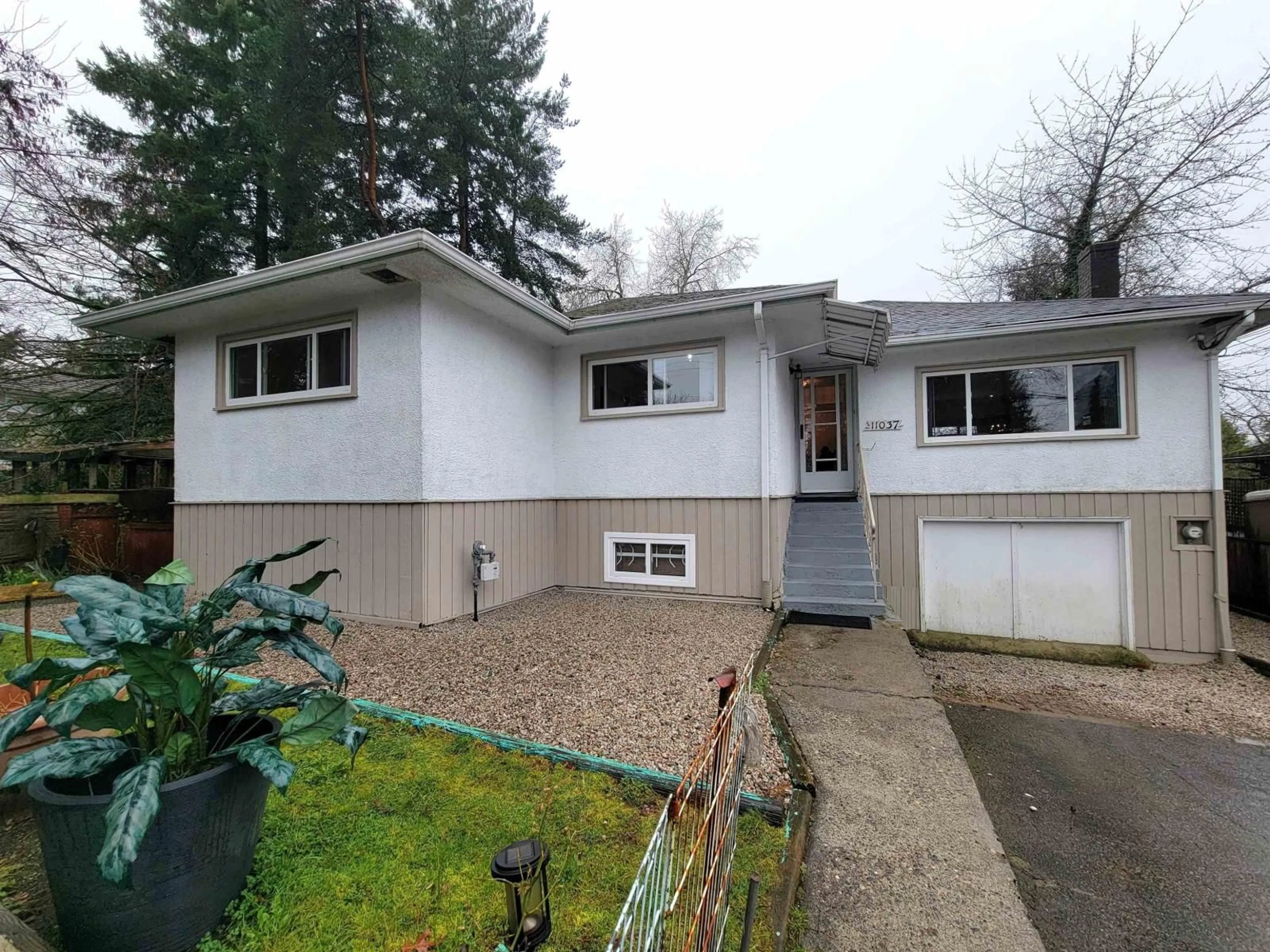 Home with vinyl exterior material, street for 11037 131 STREET, Surrey British Columbia V3T3P8