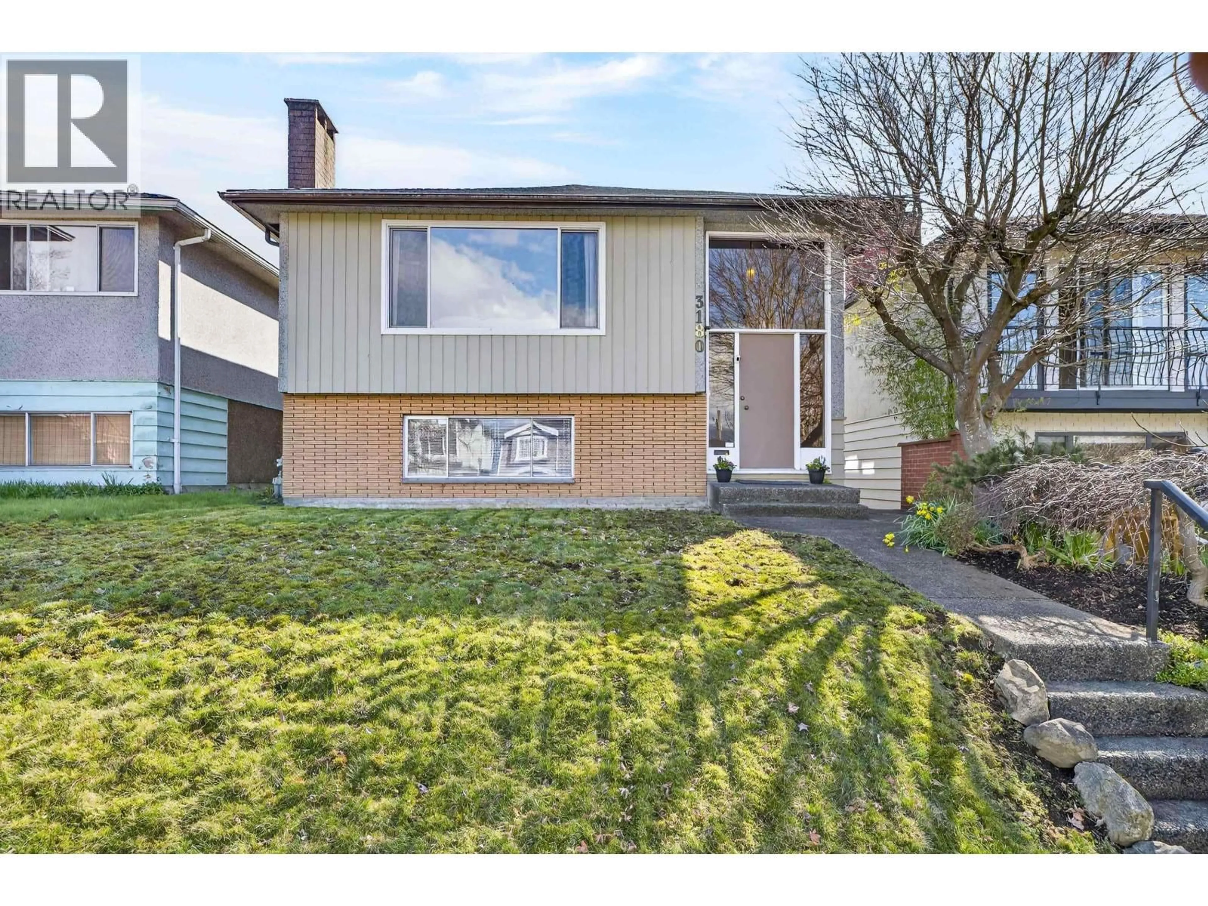 Home with vinyl exterior material, street for 3180 3RD AVENUE, Vancouver British Columbia V5M1J2