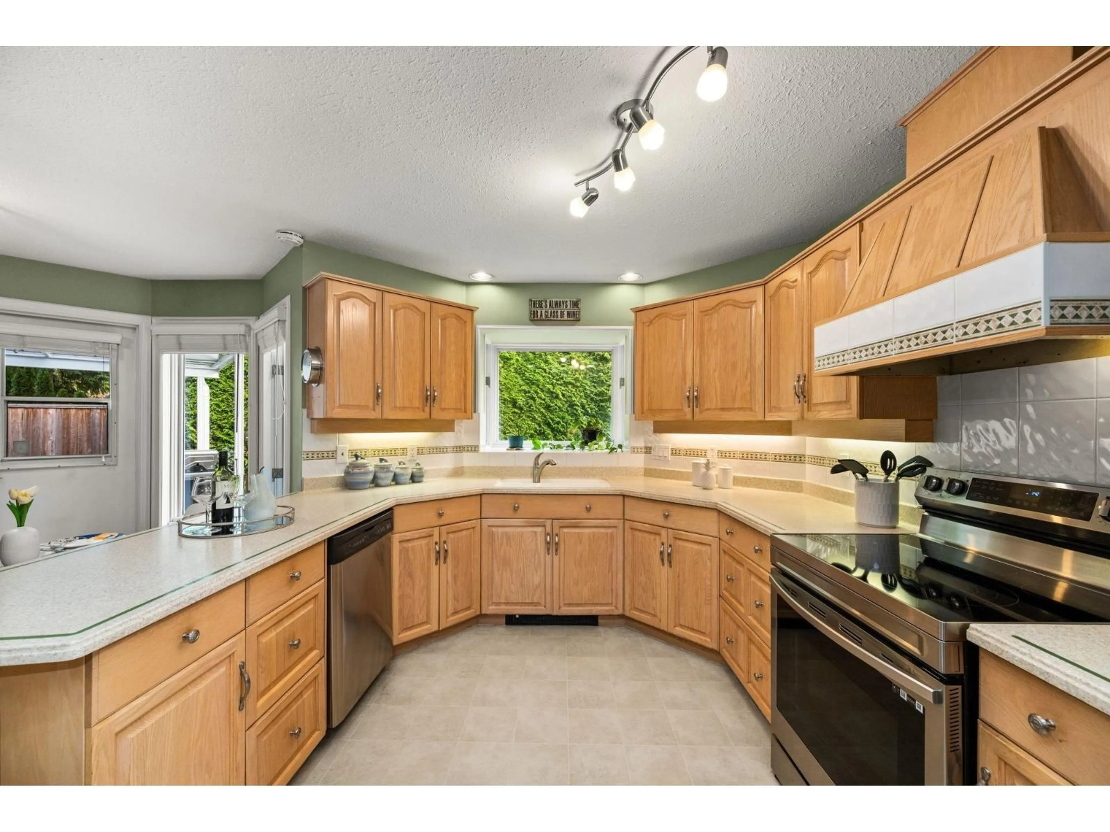 Open concept kitchen, ceramic/tile floor for 12334 56 AVENUE, Surrey British Columbia V3X2X2
