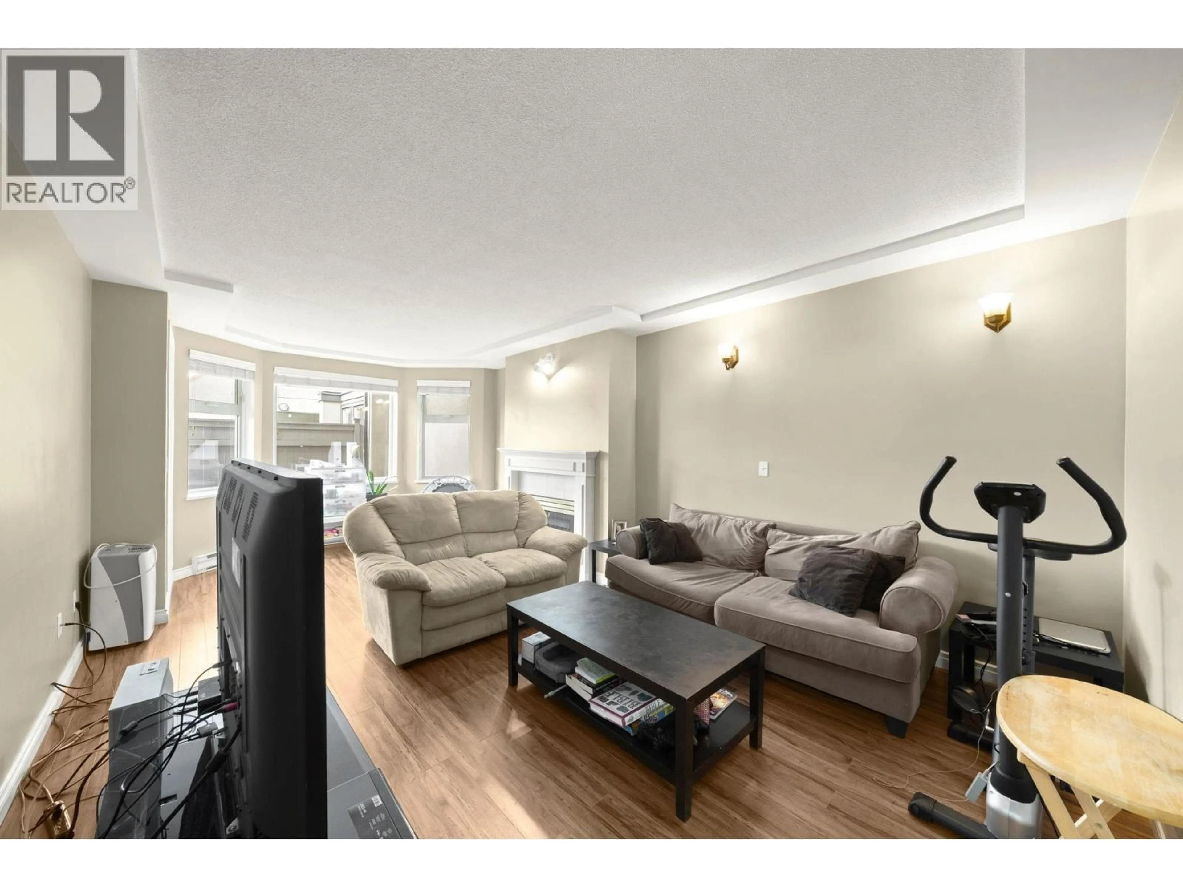 Living room with furniture, wood/laminate floor for B205 - 4821 53 STREET, Delta British Columbia V4K2Z3