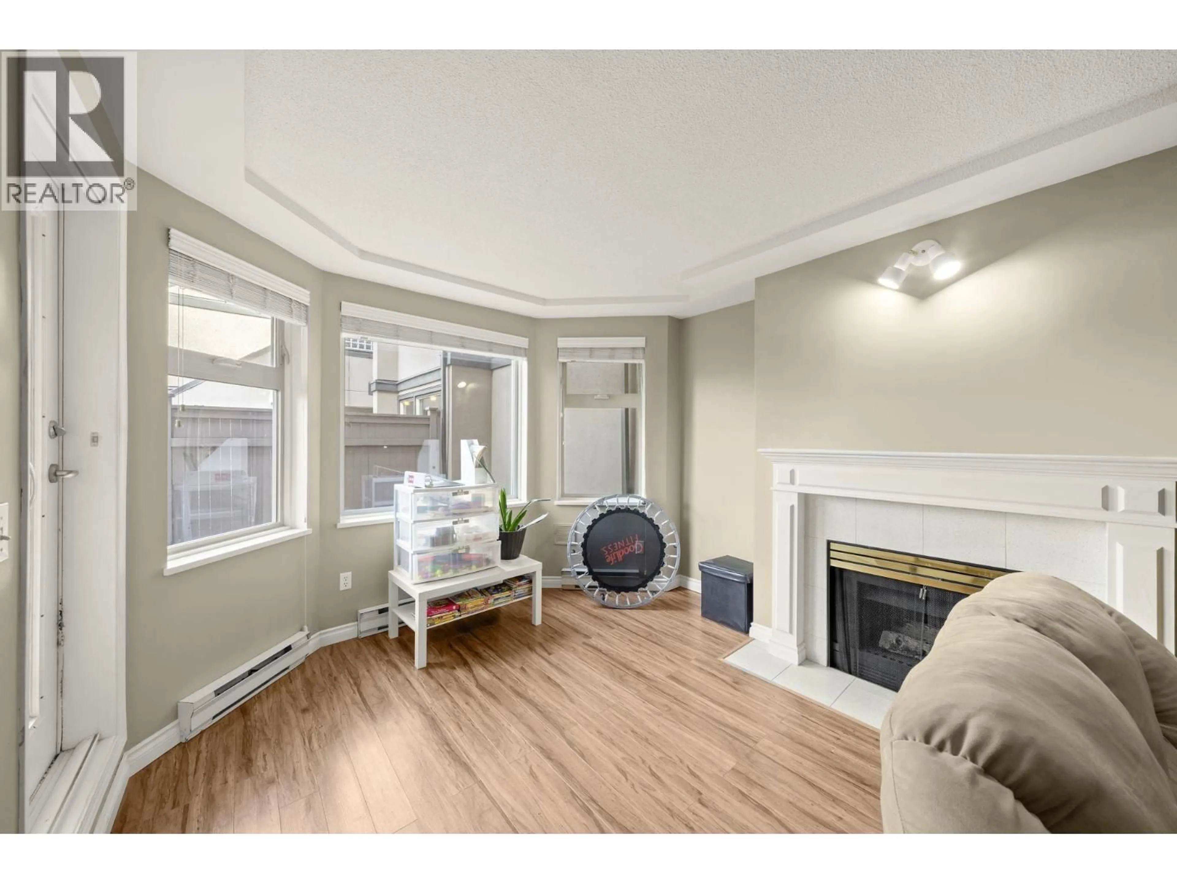 Living room with furniture, wood/laminate floor for B205 - 4821 53 STREET, Delta British Columbia V4K2Z3