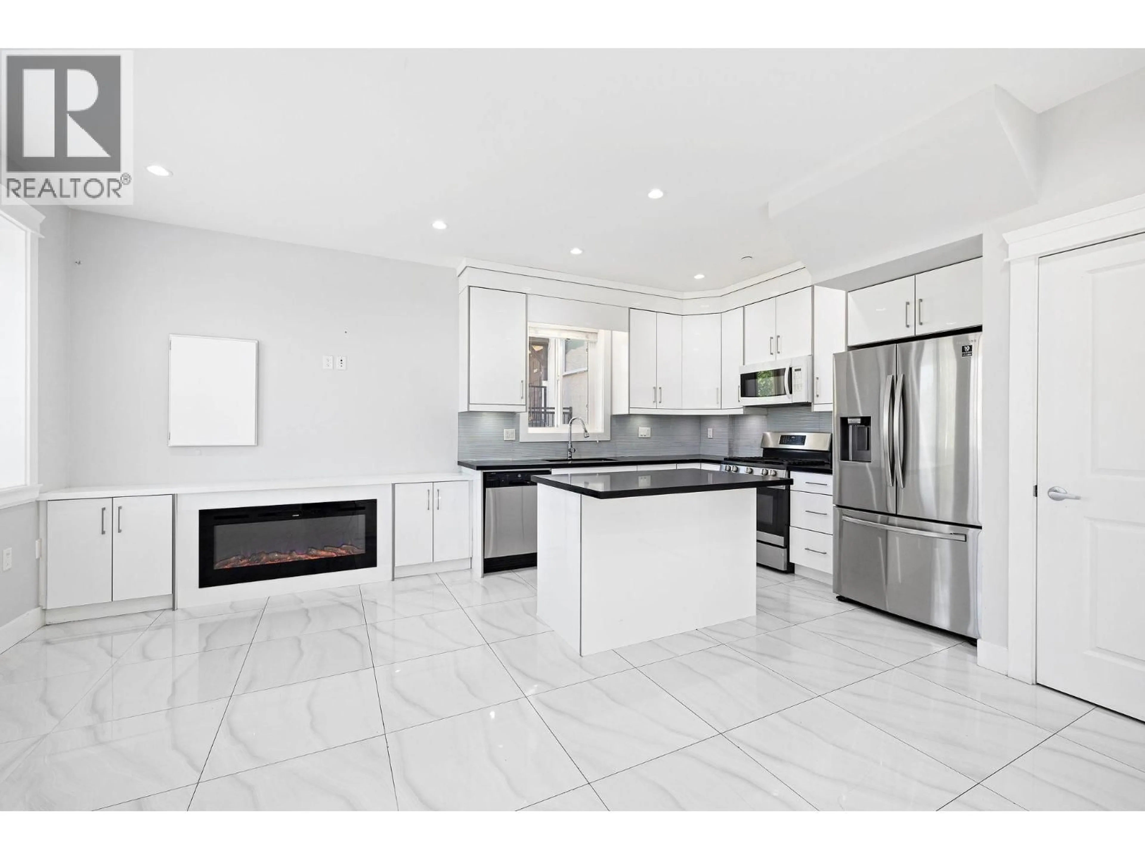 Open concept kitchen, ceramic/tile floor for 1 - 2430 41 STREET, Vancouver British Columbia V5R2W4