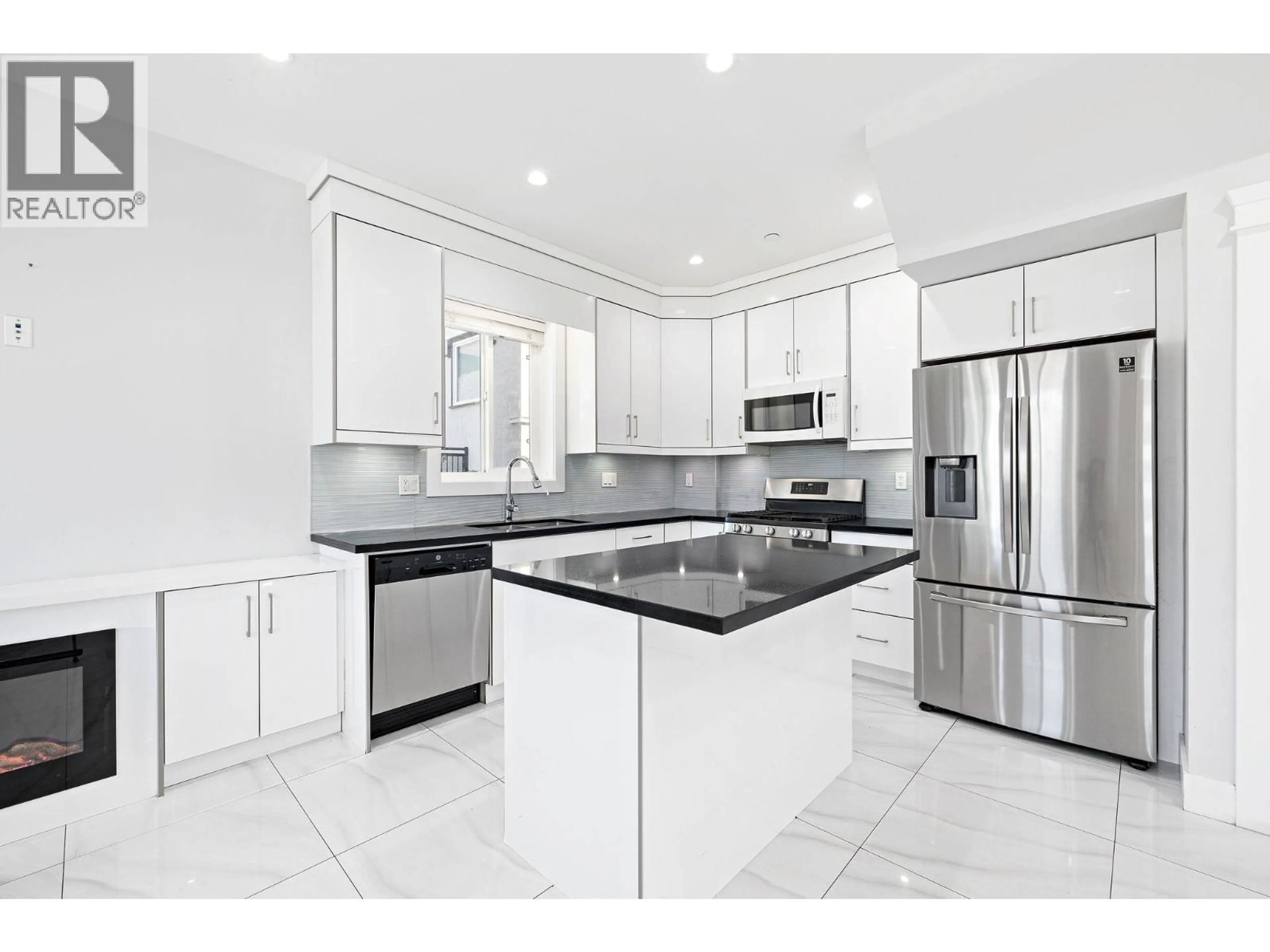 Open concept kitchen, ceramic/tile floor for 1 - 2430 41 STREET, Vancouver British Columbia V5R2W4