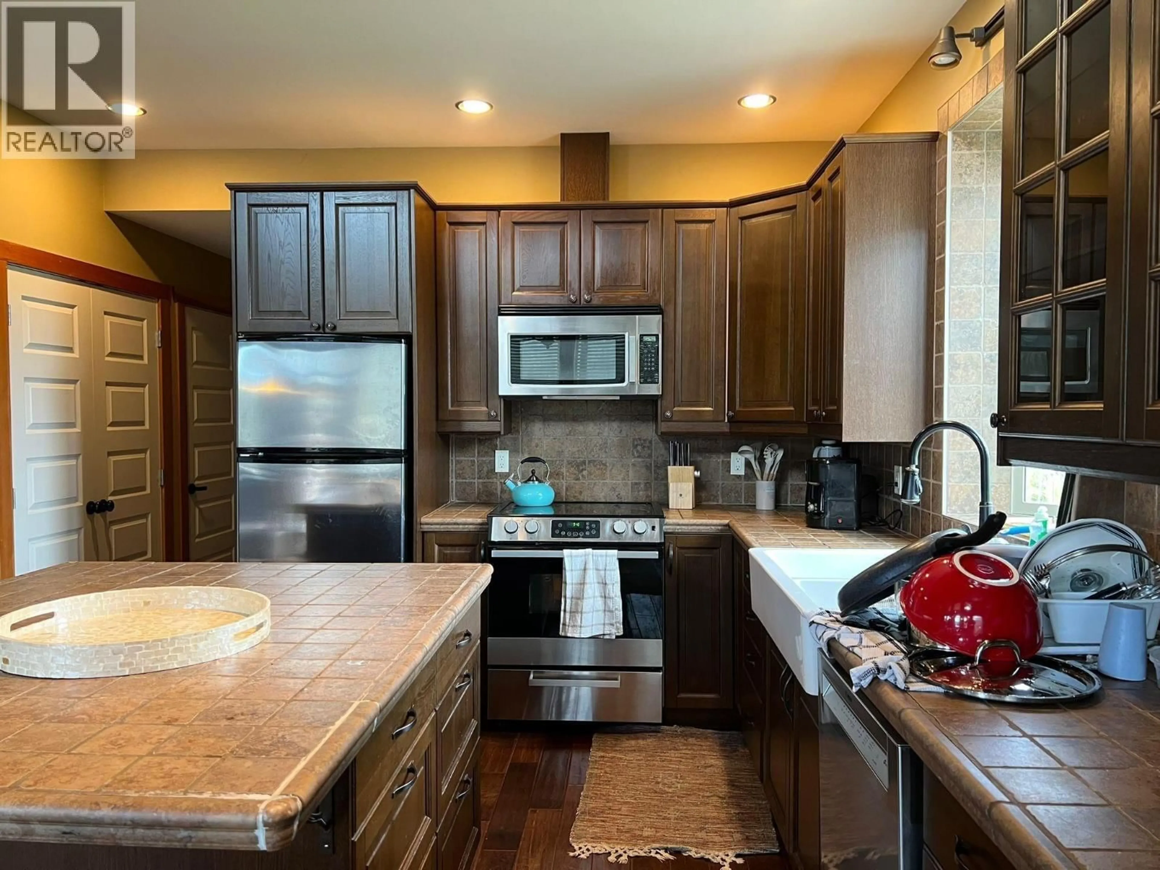 Open concept kitchen, ceramic/tile floor for 651 A ROAD, 100 Mile House British Columbia V0K1J0