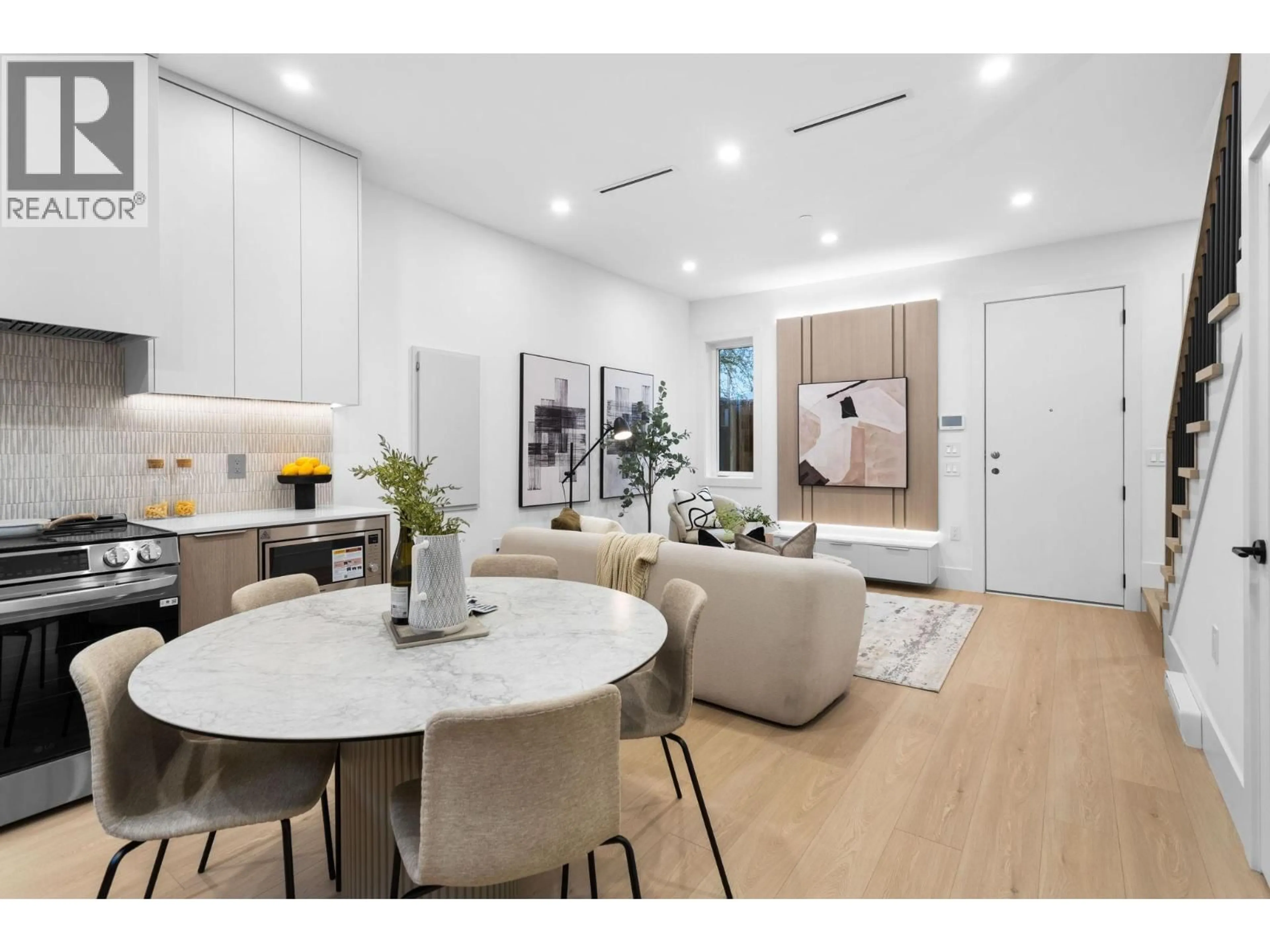 Open concept kitchen, wood/laminate floor for 3277 GRAVELEY STREET, Vancouver British Columbia V5K3K8