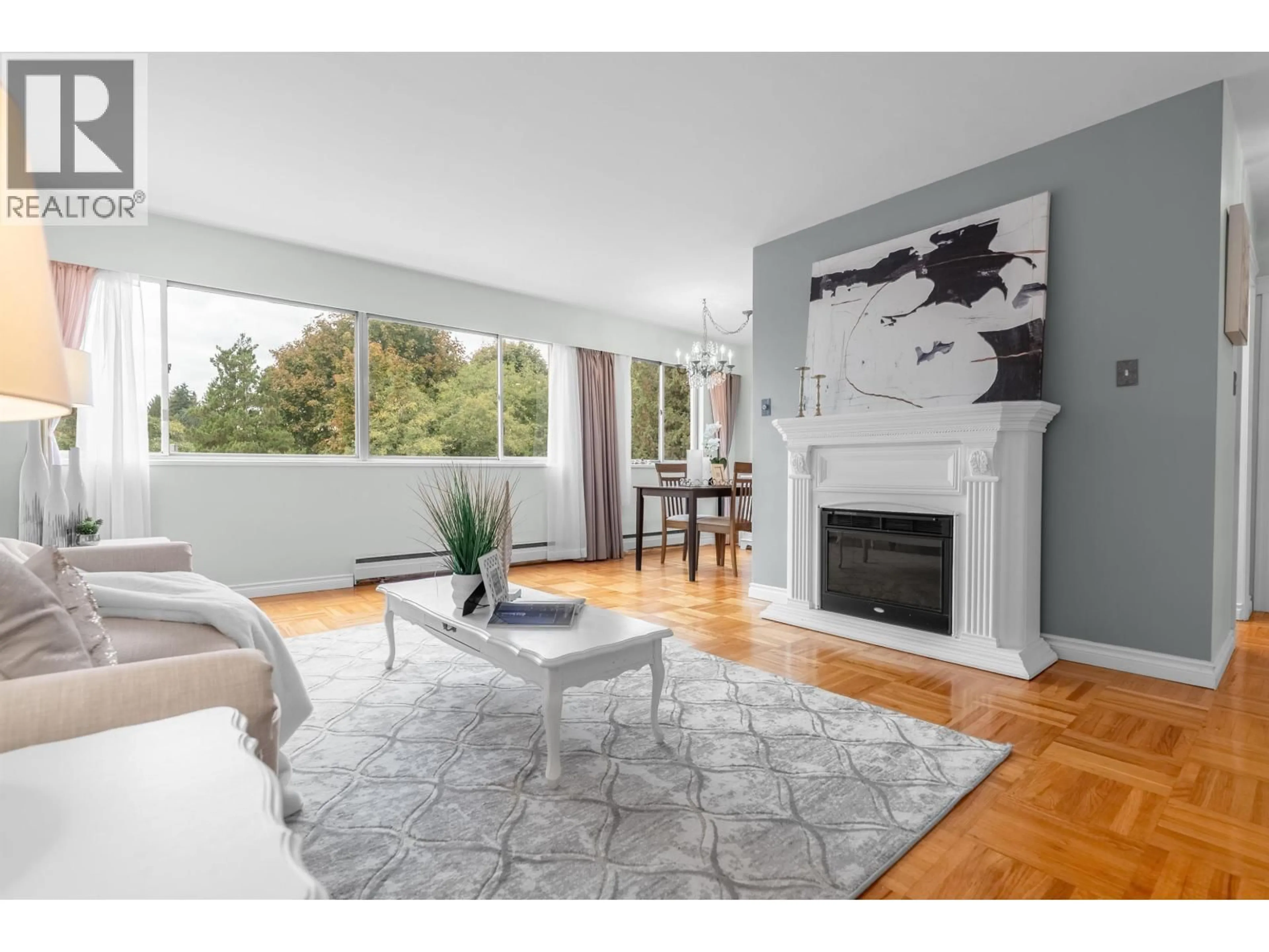 Living room with furniture, wood/laminate floor for 402 - 1750 ESQUIMALT AVENUE, West Vancouver British Columbia V7V1R8