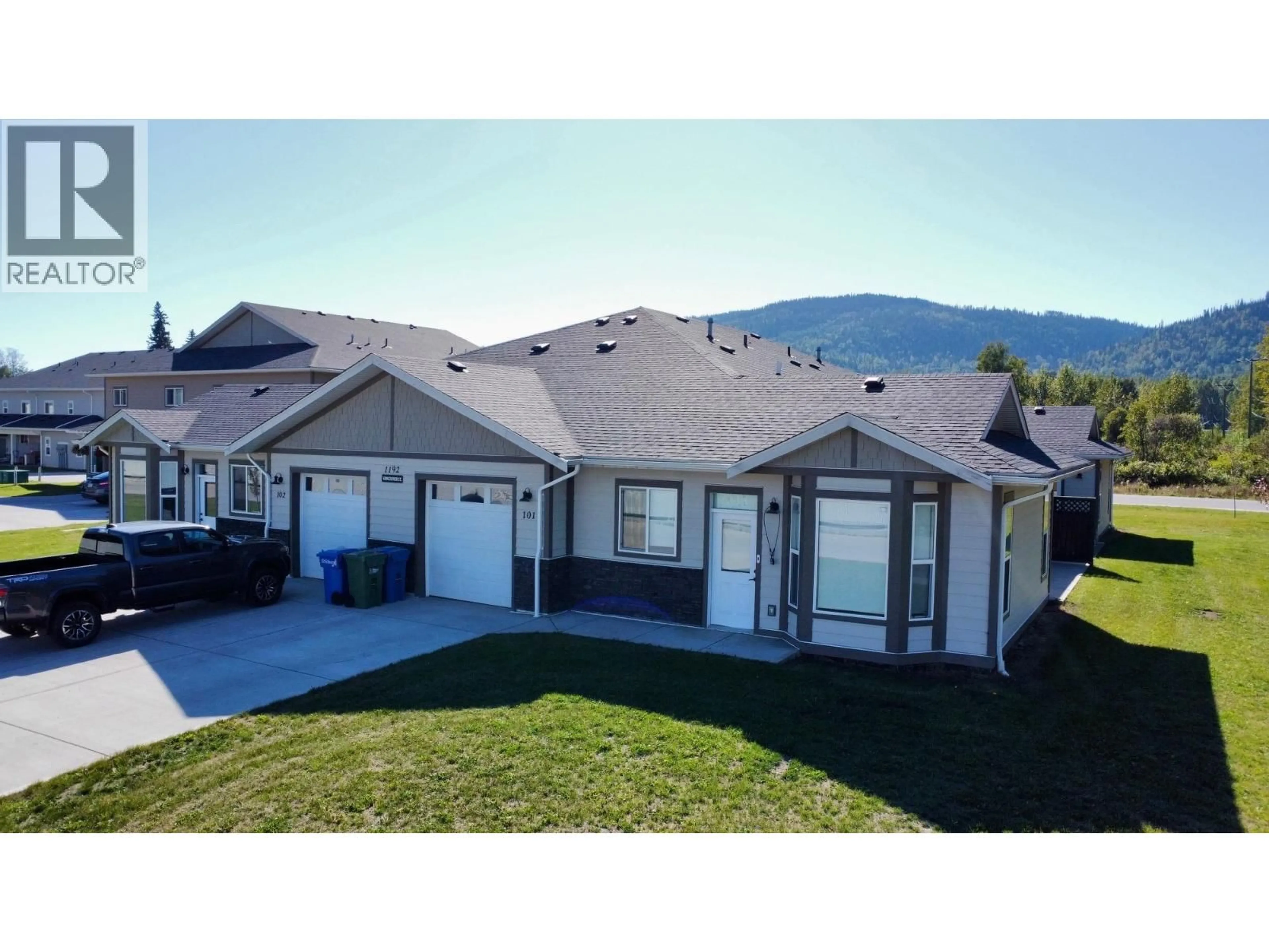 A pic from outside/outdoor area/front of a property/back of a property/a pic from drone, mountain view for 101 - 1192 VANCOUVER STREET, Smithers British Columbia V0J2N0
