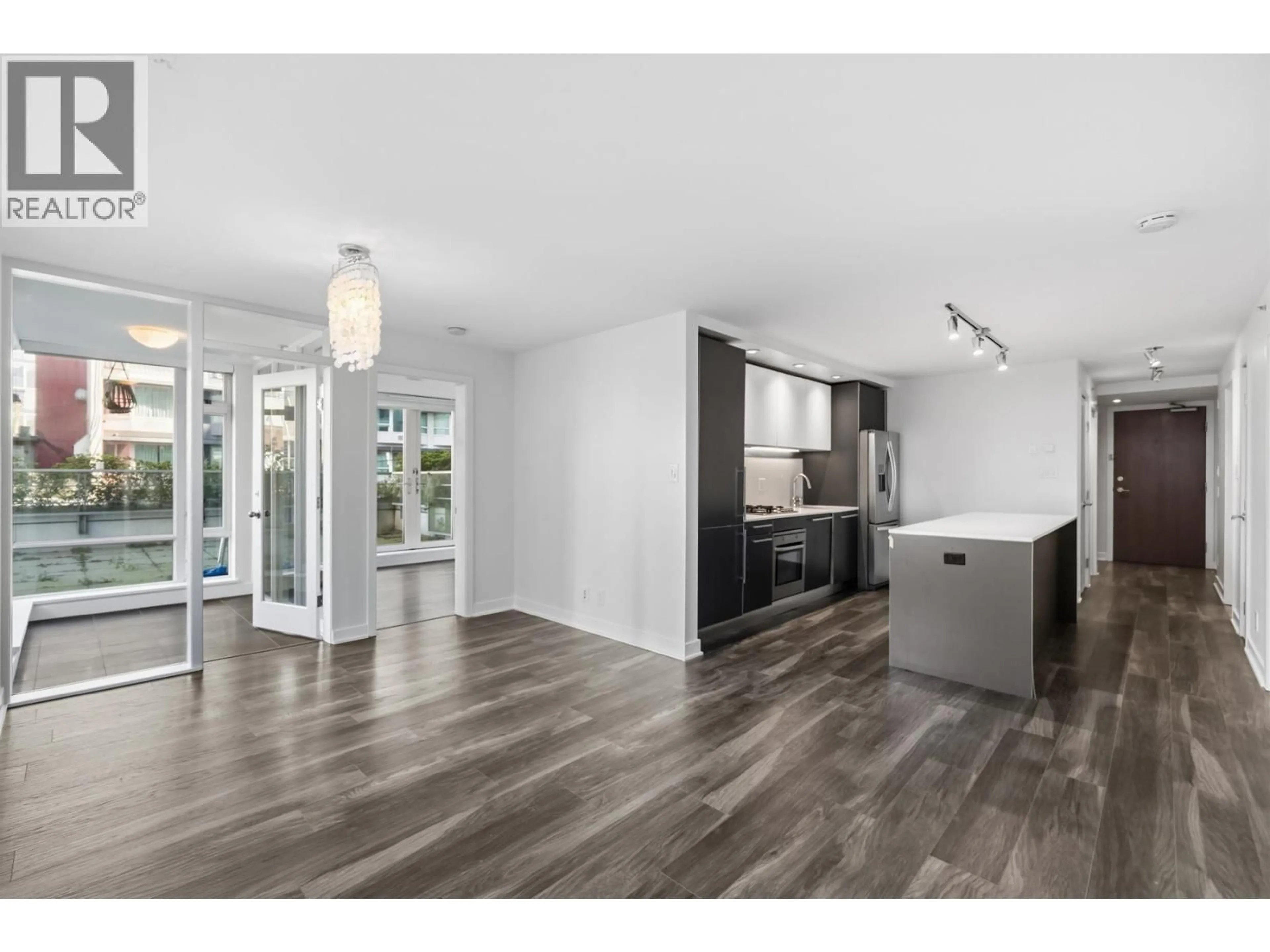 Open concept kitchen, wood/laminate floor for 301 - 1762 DAVIE STREET, Vancouver British Columbia V6G1W2