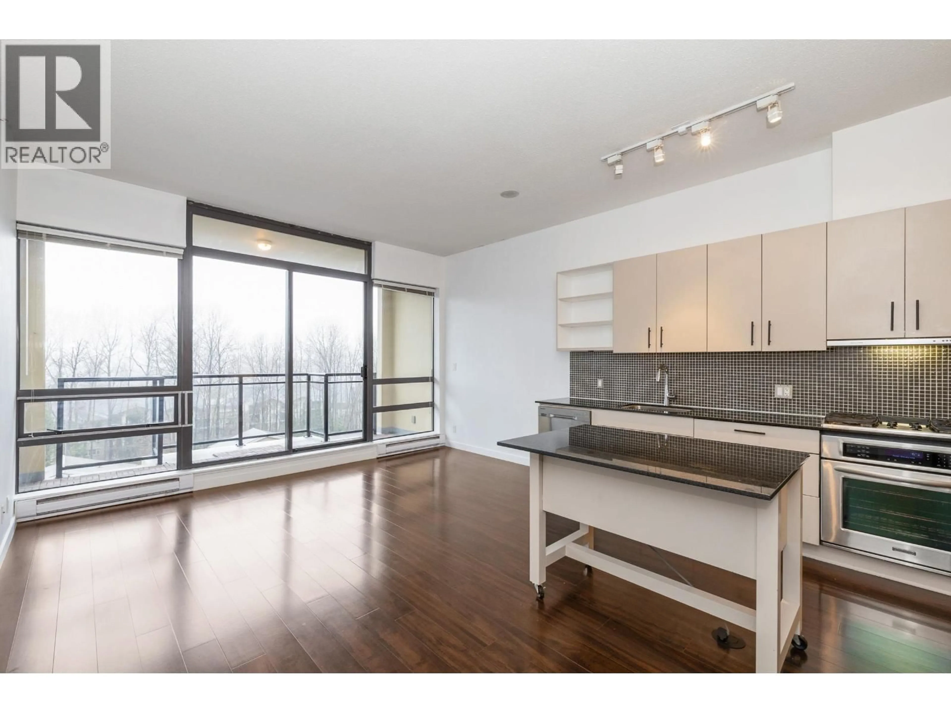 Open concept kitchen, wood/laminate floor for 710 - 121 BREW STREET, Port Moody British Columbia V3H0E2