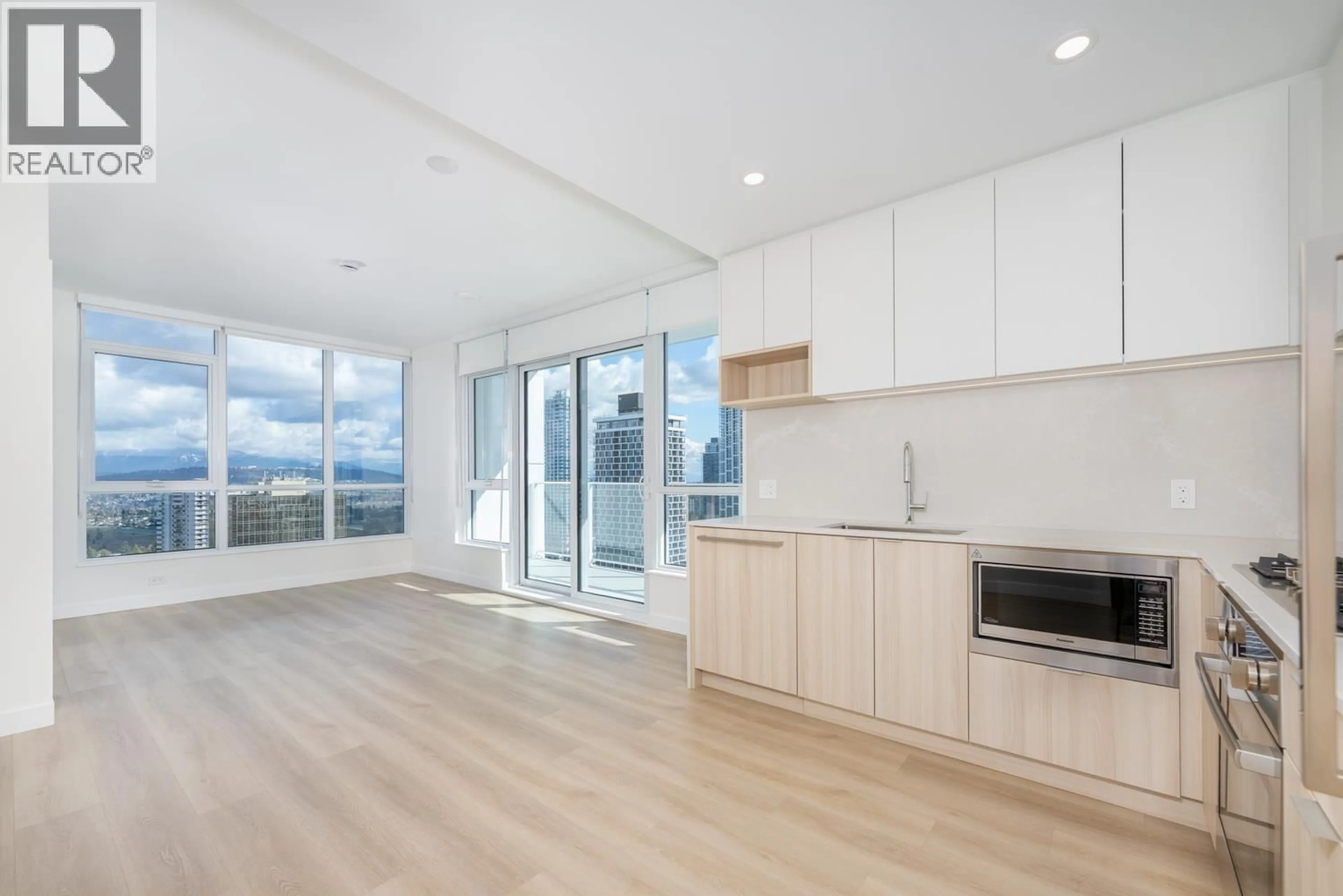 Open concept kitchen, wood/laminate floor for 2304 - 6087 WILSON AVENUE, Burnaby British Columbia V5H0M1