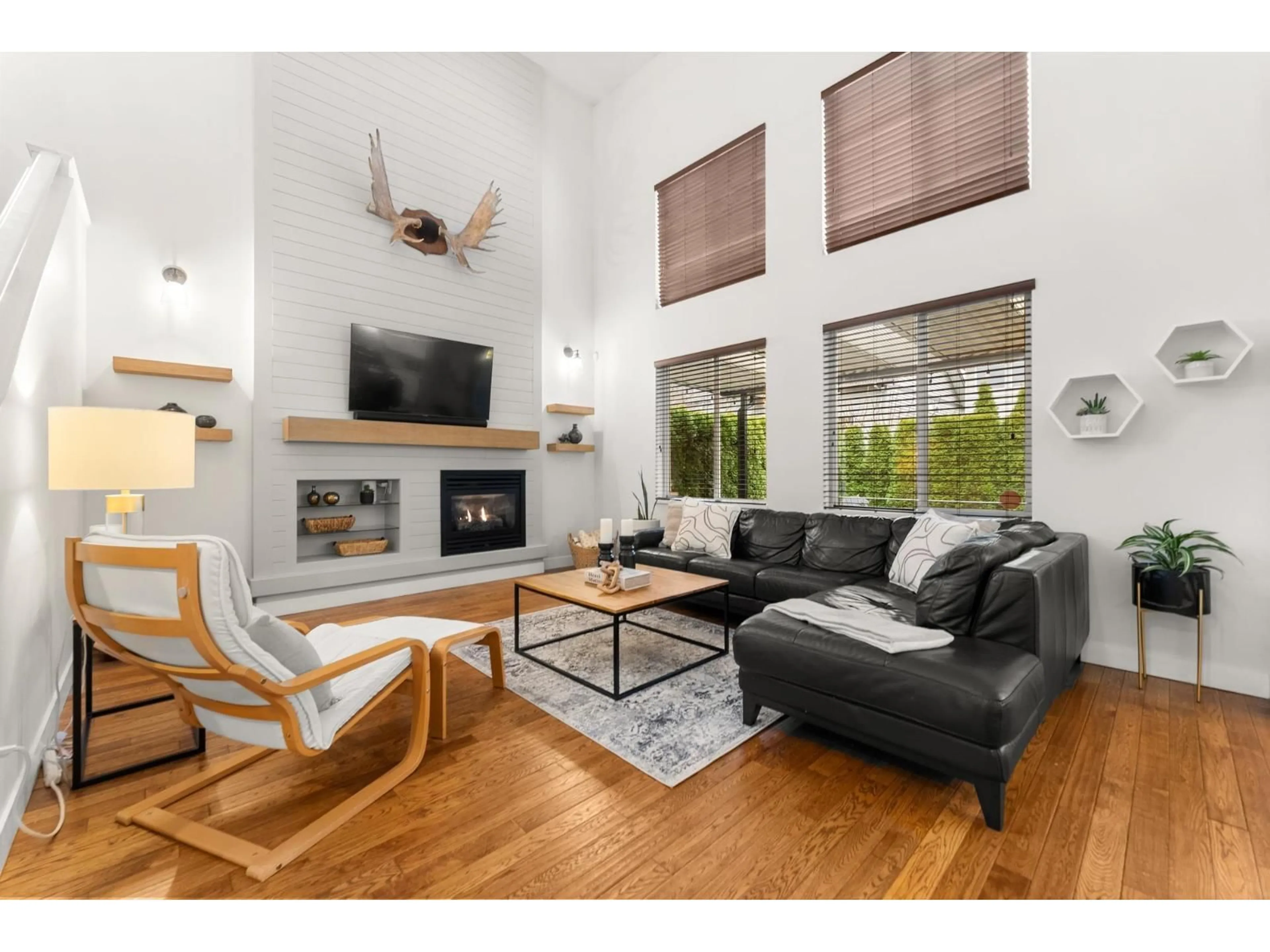 Living room with furniture, wood/laminate floor for 14918 59 AVENUE, Surrey British Columbia V3S3W8