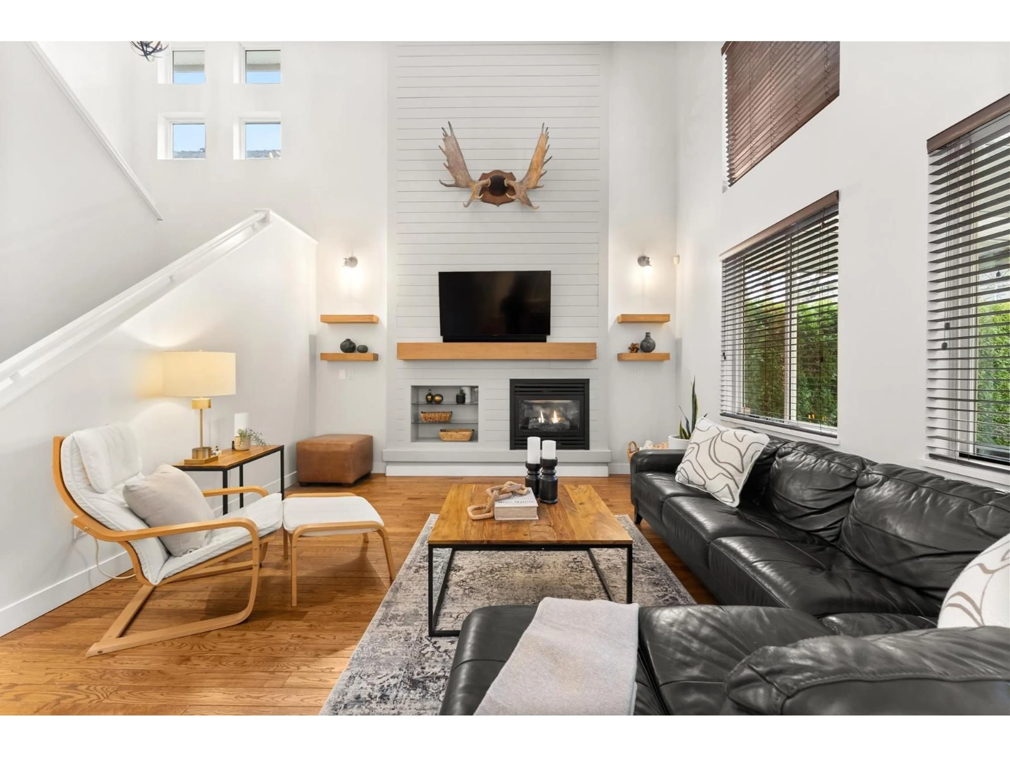 Living room with furniture, wood/laminate floor for 14918 59 AVENUE, Surrey British Columbia V3S3W8