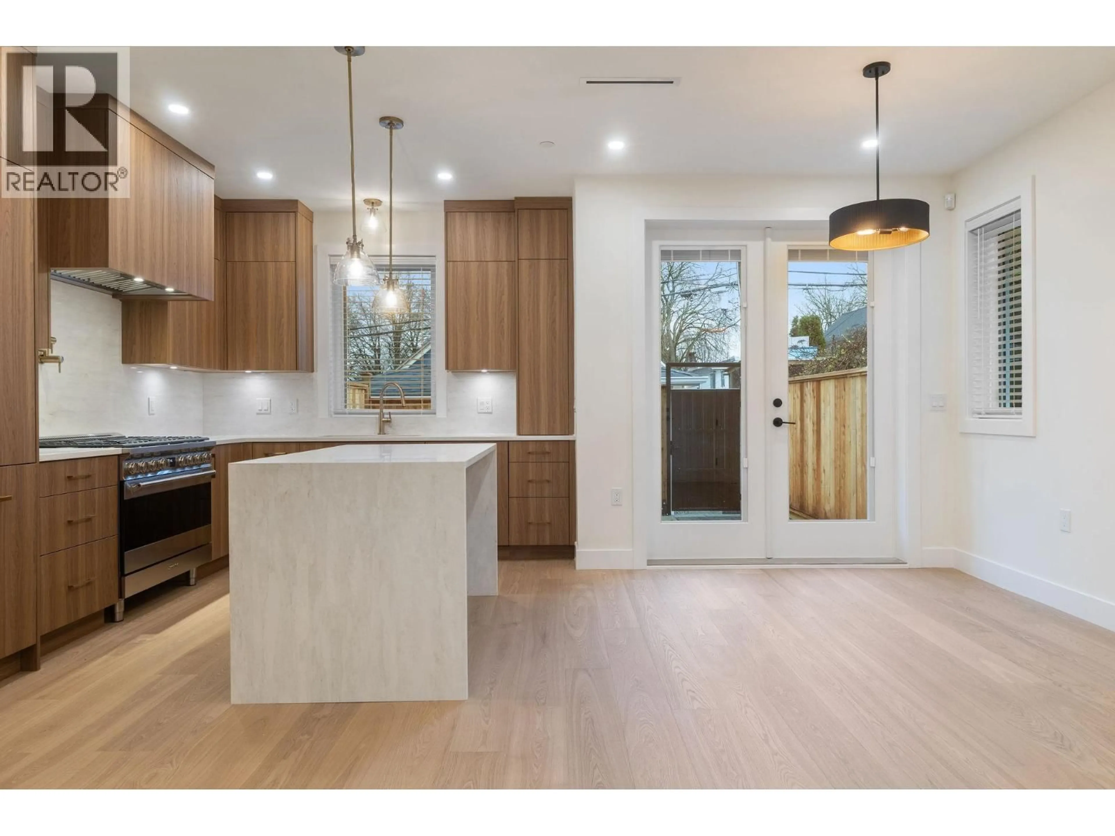 Open concept kitchen, wood/laminate floor for 2055 4TH AVENUE, Vancouver British Columbia V5N1K5