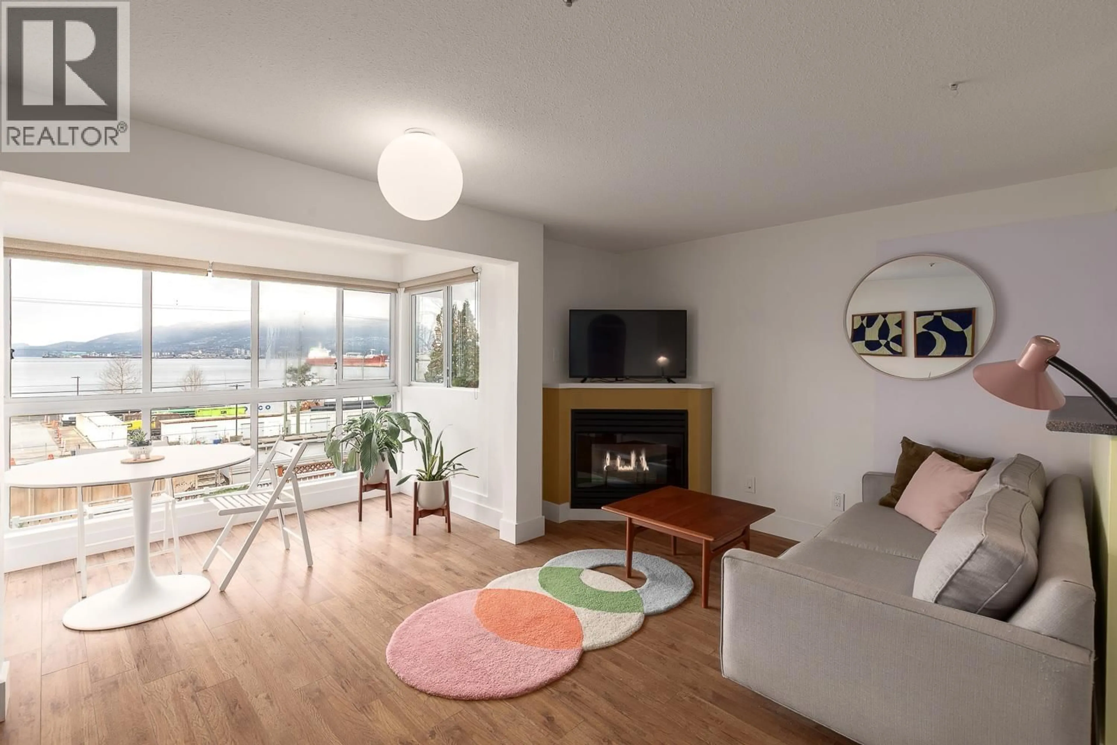 Living room with furniture, wood/laminate floor for 207 - 2211 WALL STREET, Vancouver British Columbia V5L1G4