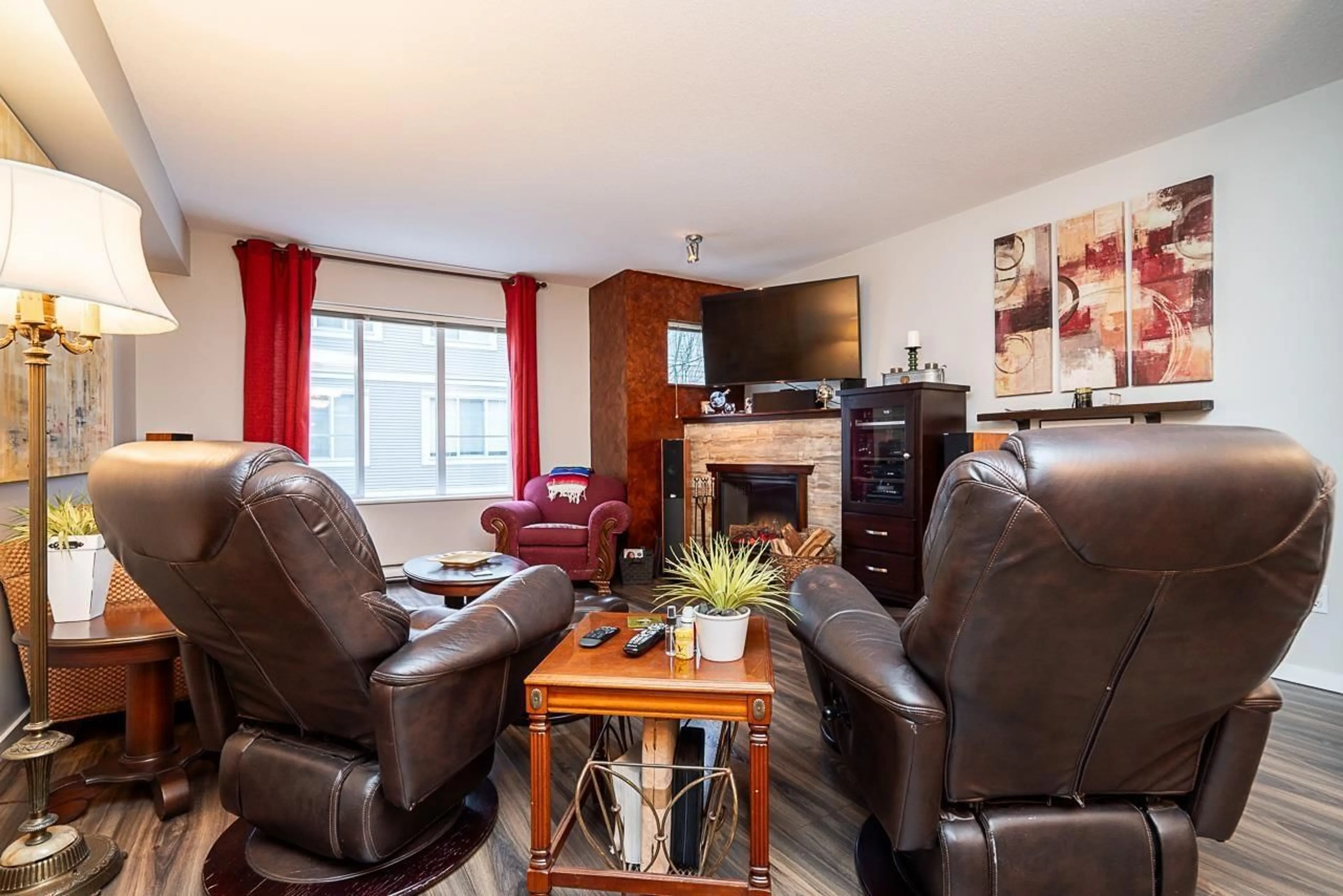 Living room with furniture, wood/laminate floor for 79 - 15155 62A AVENUE, Surrey British Columbia V3S8A6