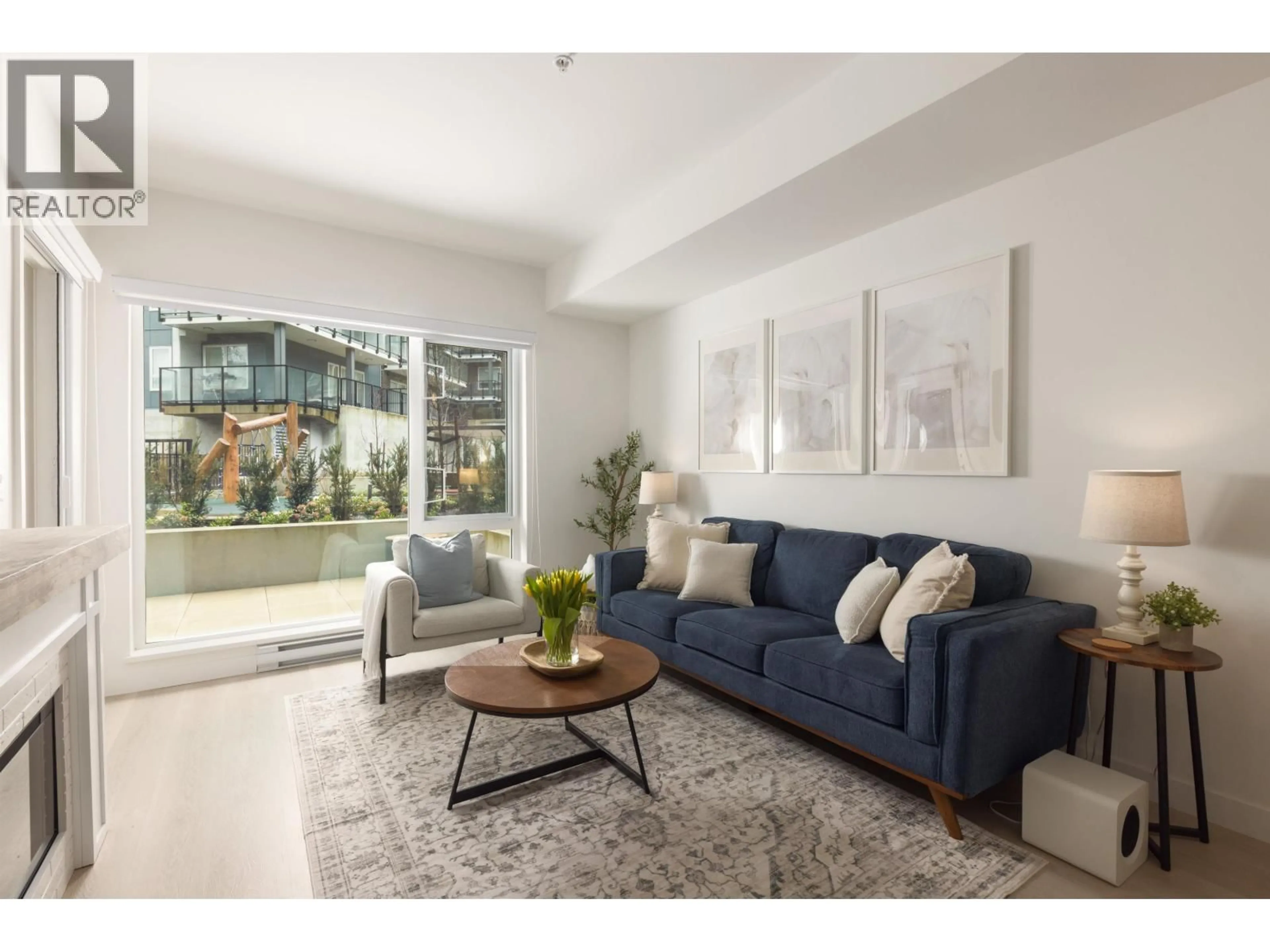 Living room with furniture, unknown for 208 - 1100 CLARKE ROAD, Port Moody British Columbia V3H0N3