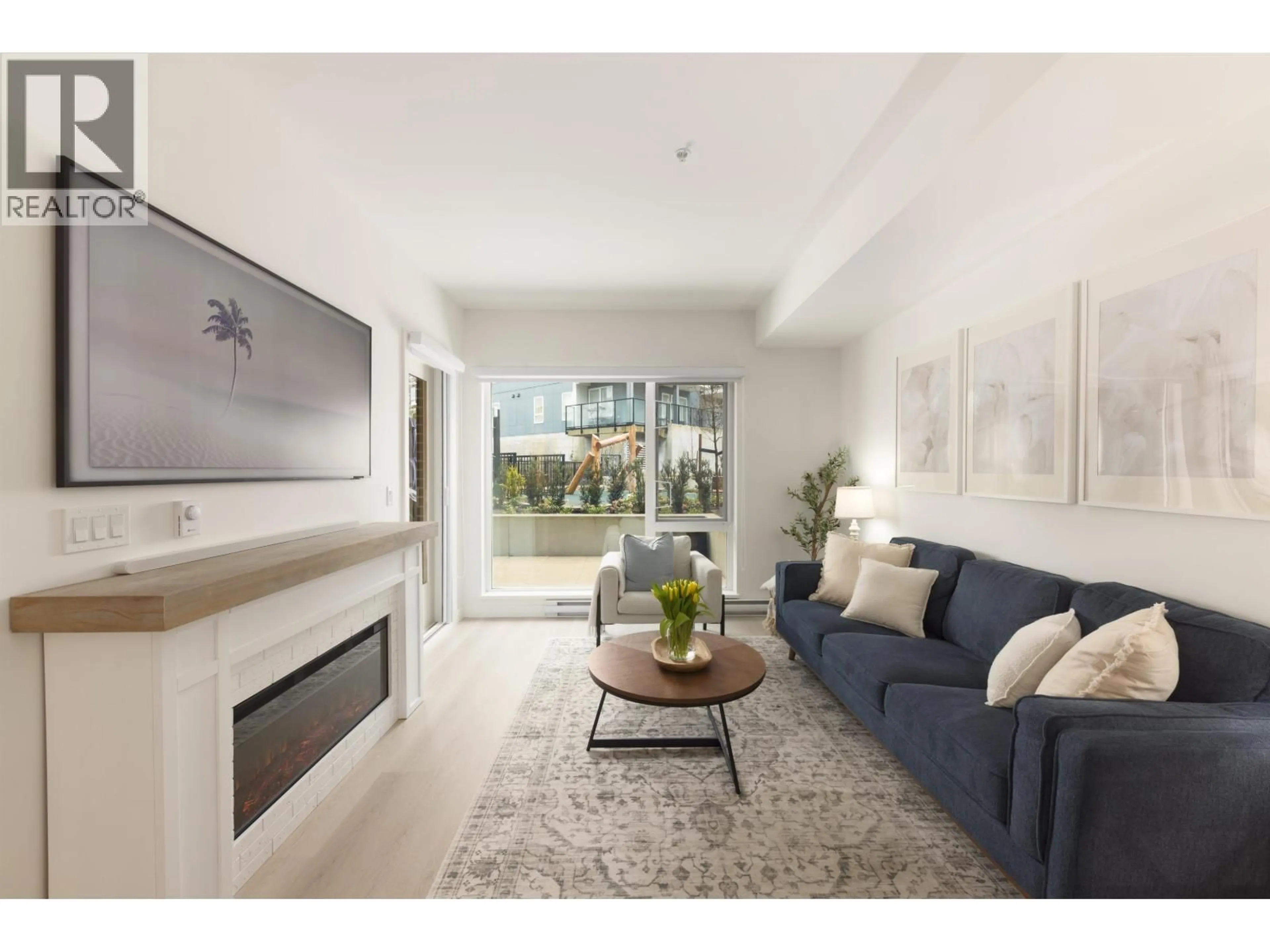 Living room with furniture, unknown for 208 - 1100 CLARKE ROAD, Port Moody British Columbia V3H0N3