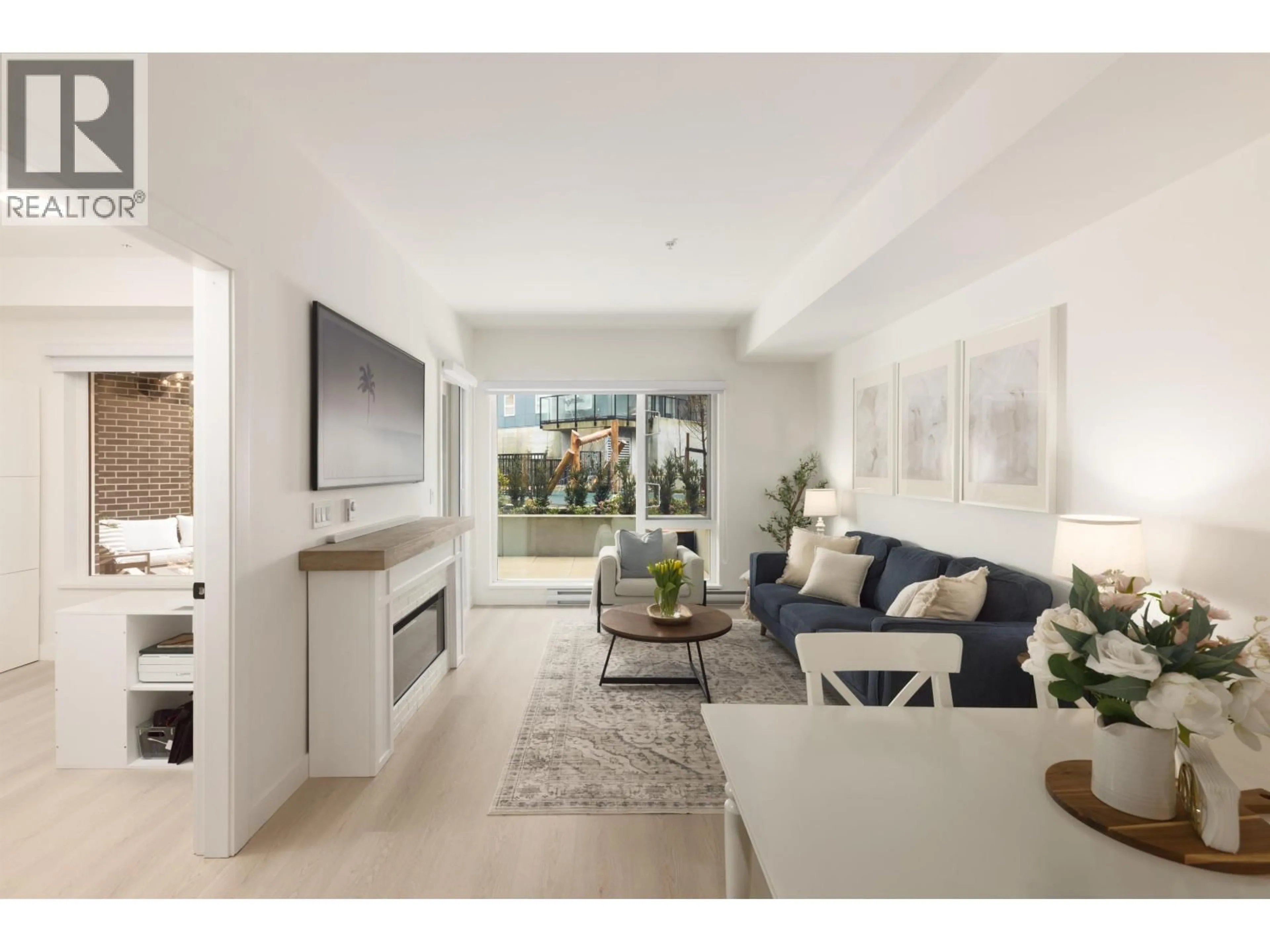 Living room with furniture, unknown for 208 - 1100 CLARKE ROAD, Port Moody British Columbia V3H0N3