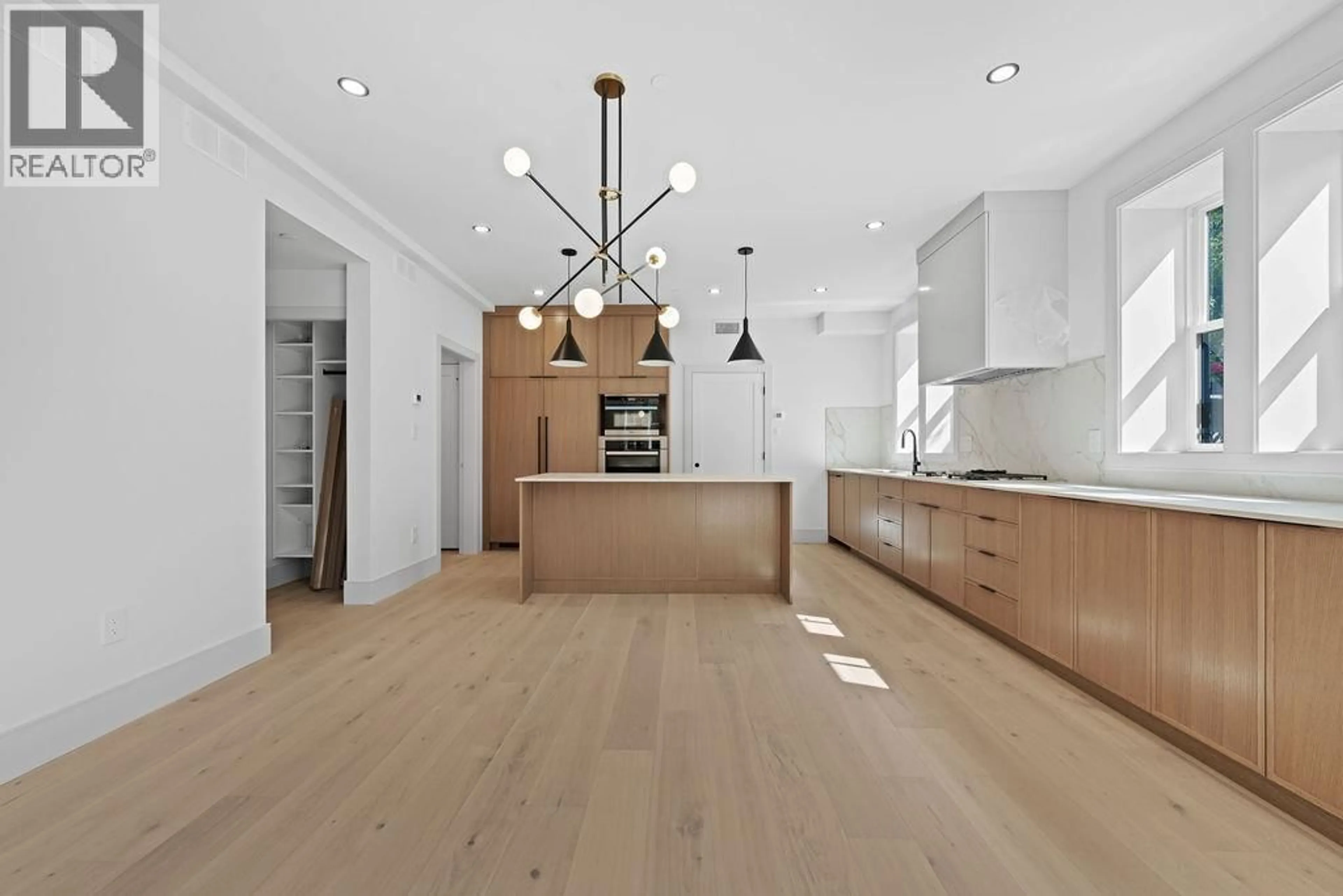 Open concept kitchen, wood/laminate floor for 6851 CYPRESS STREET, Vancouver British Columbia V6P5L9