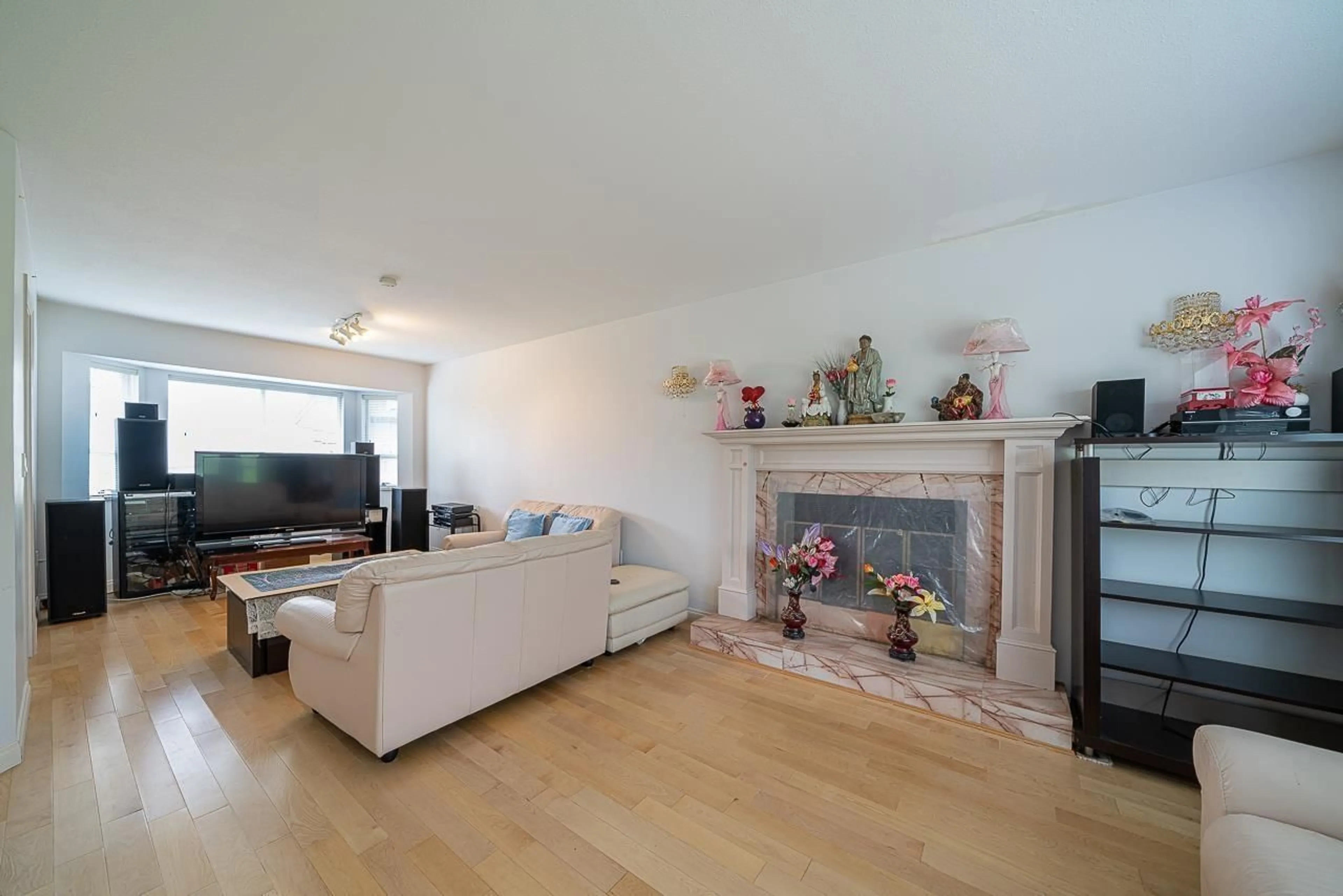 Living room with furniture, wood/laminate floor for 13346 92 AVENUE, Surrey British Columbia V3V7S9