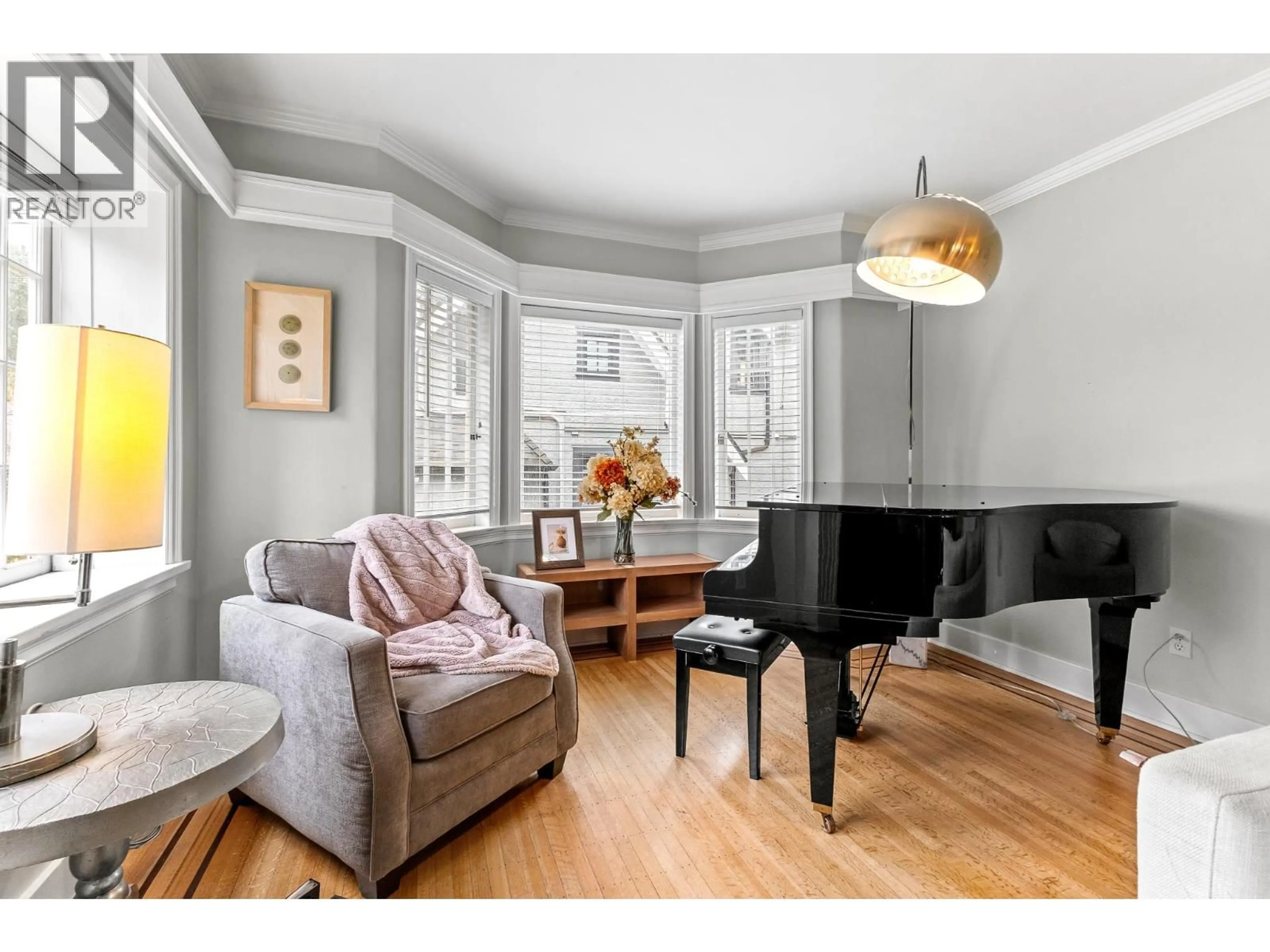 Living room with furniture, wood/laminate floor for 6713 ARBUTUS STREET, Vancouver British Columbia V6P5S6