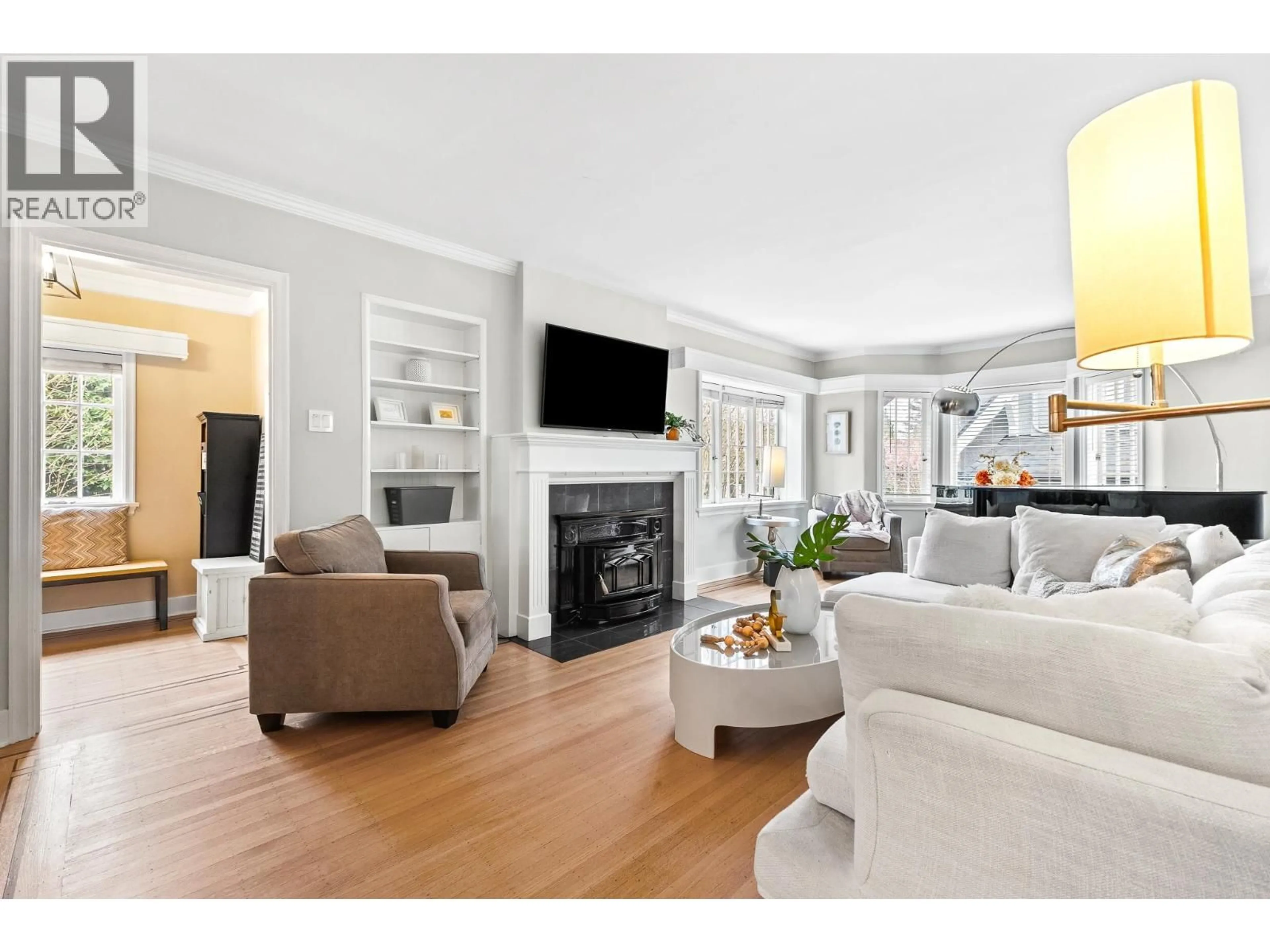 Living room with furniture, wood/laminate floor for 6713 ARBUTUS STREET, Vancouver British Columbia V6P5S6