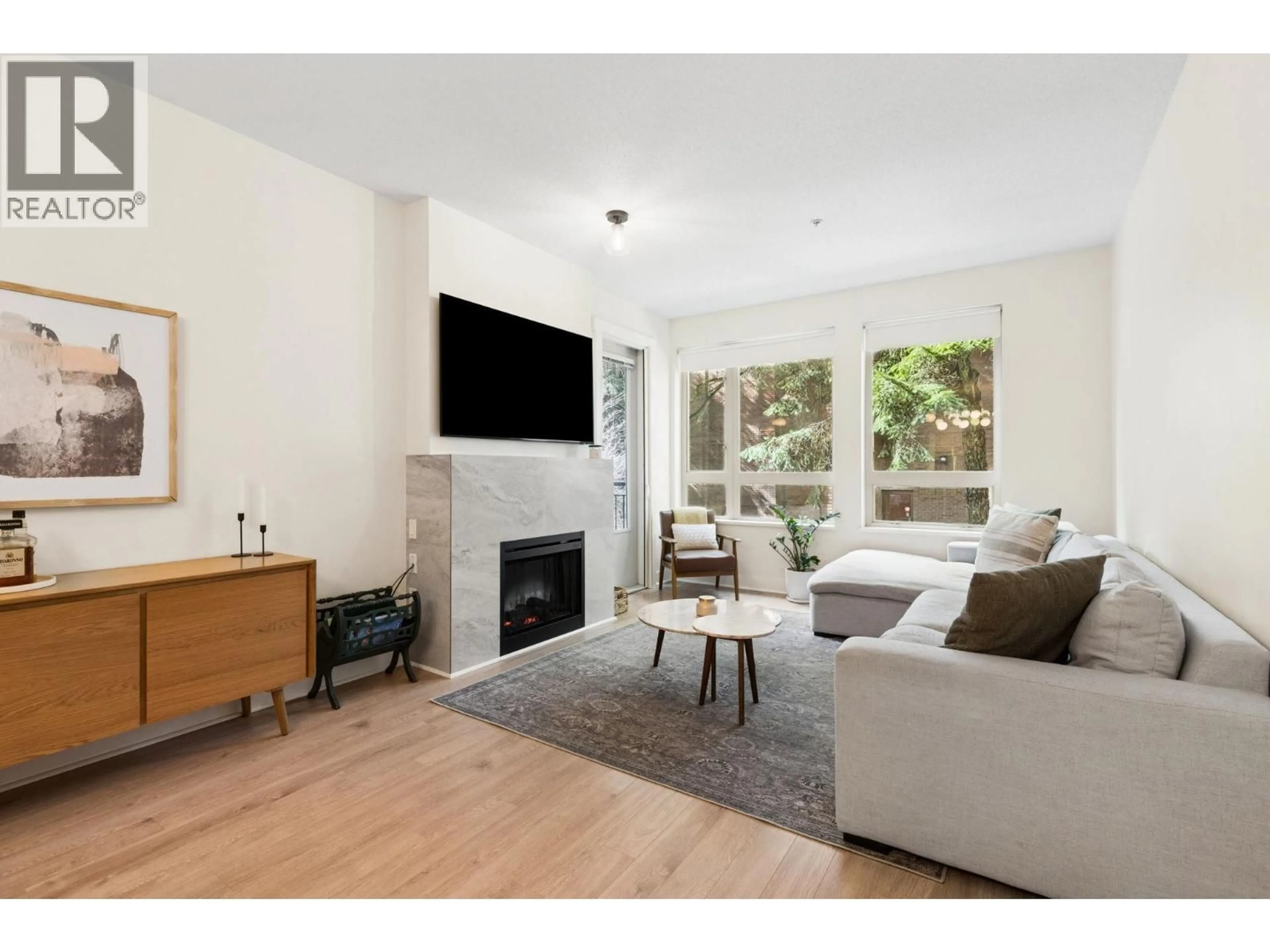 Living room with furniture, wood/laminate floor for 218 - 1111 27TH STREET, North Vancouver British Columbia V7J1S3