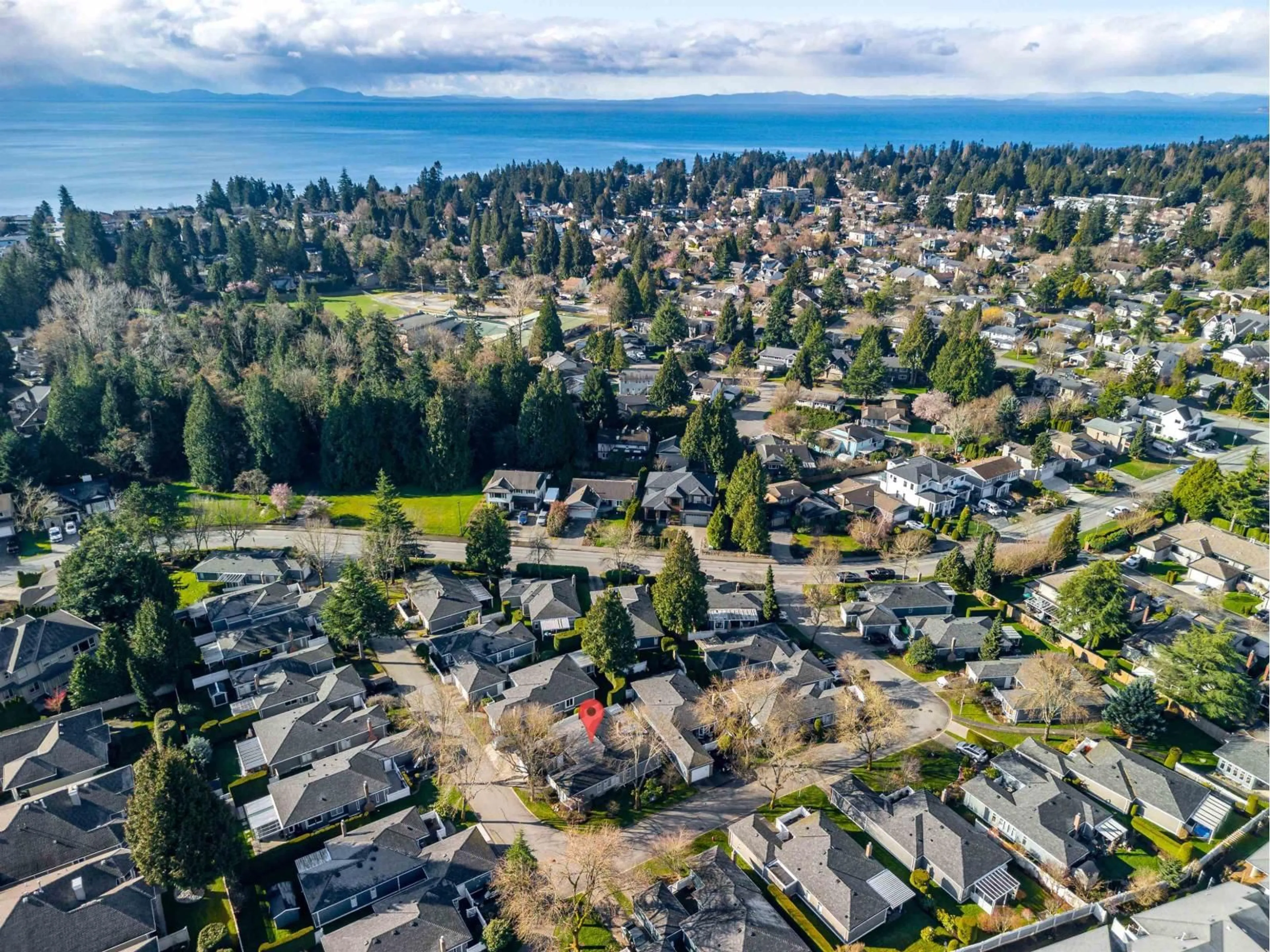 A pic from outside/outdoor area/front of a property/back of a property/a pic from drone, water/lake/river/ocean view for 113 - 14271 18A AVENUE, Surrey British Columbia V4A7N8