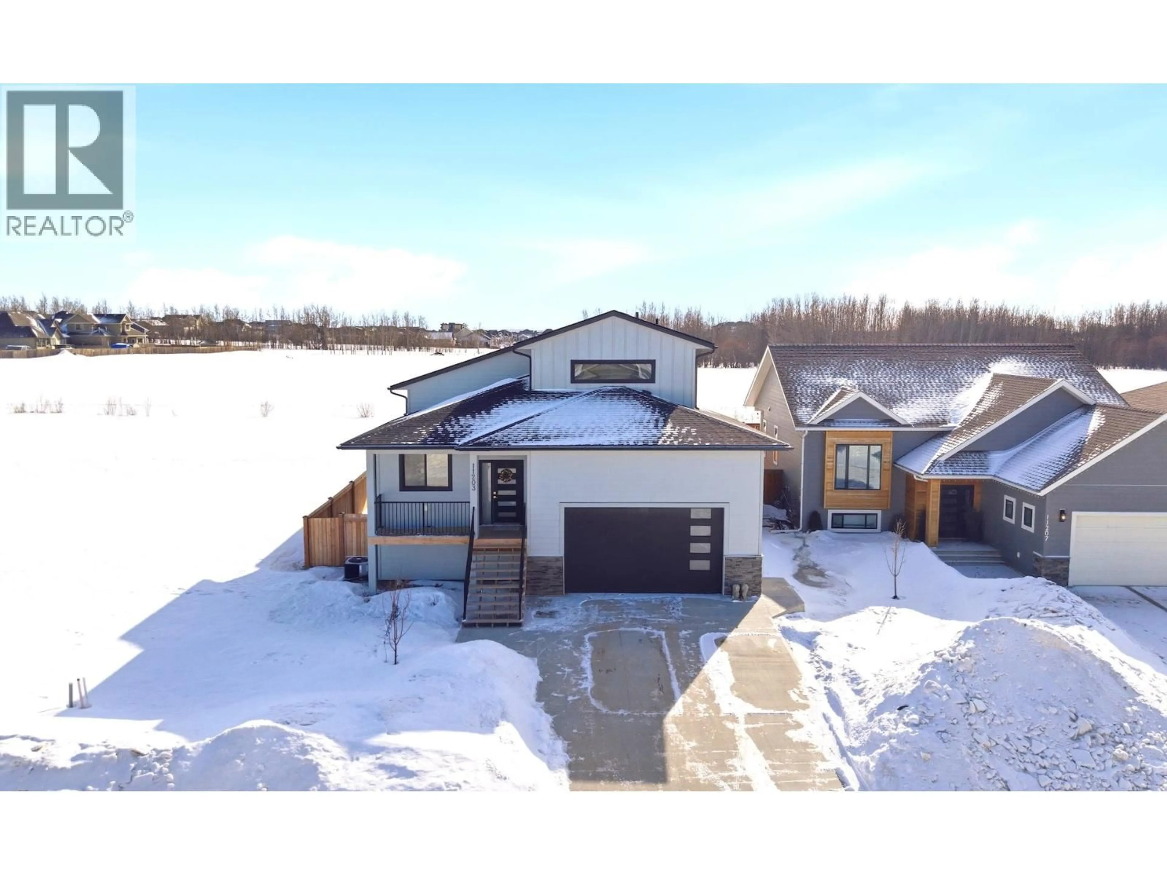 A pic from outside/outdoor area/front of a property/back of a property/a pic from drone, unknown for 11203 112 AVENUE, Fort St. John British Columbia V1J0R5