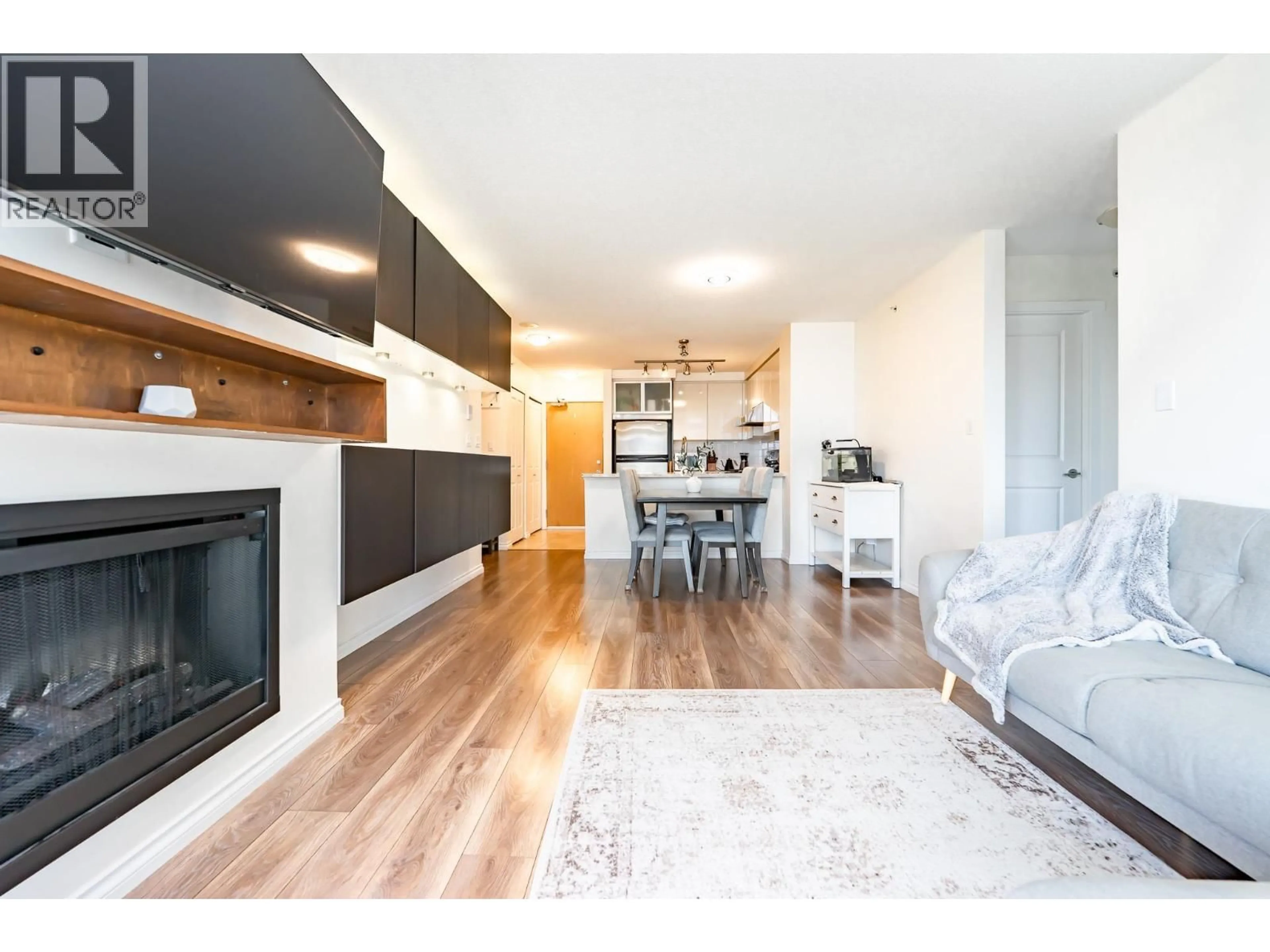 Living room with furniture, wood/laminate floor for 2703 - 2289 YUKON CRESCENT, Burnaby British Columbia V5C0B2