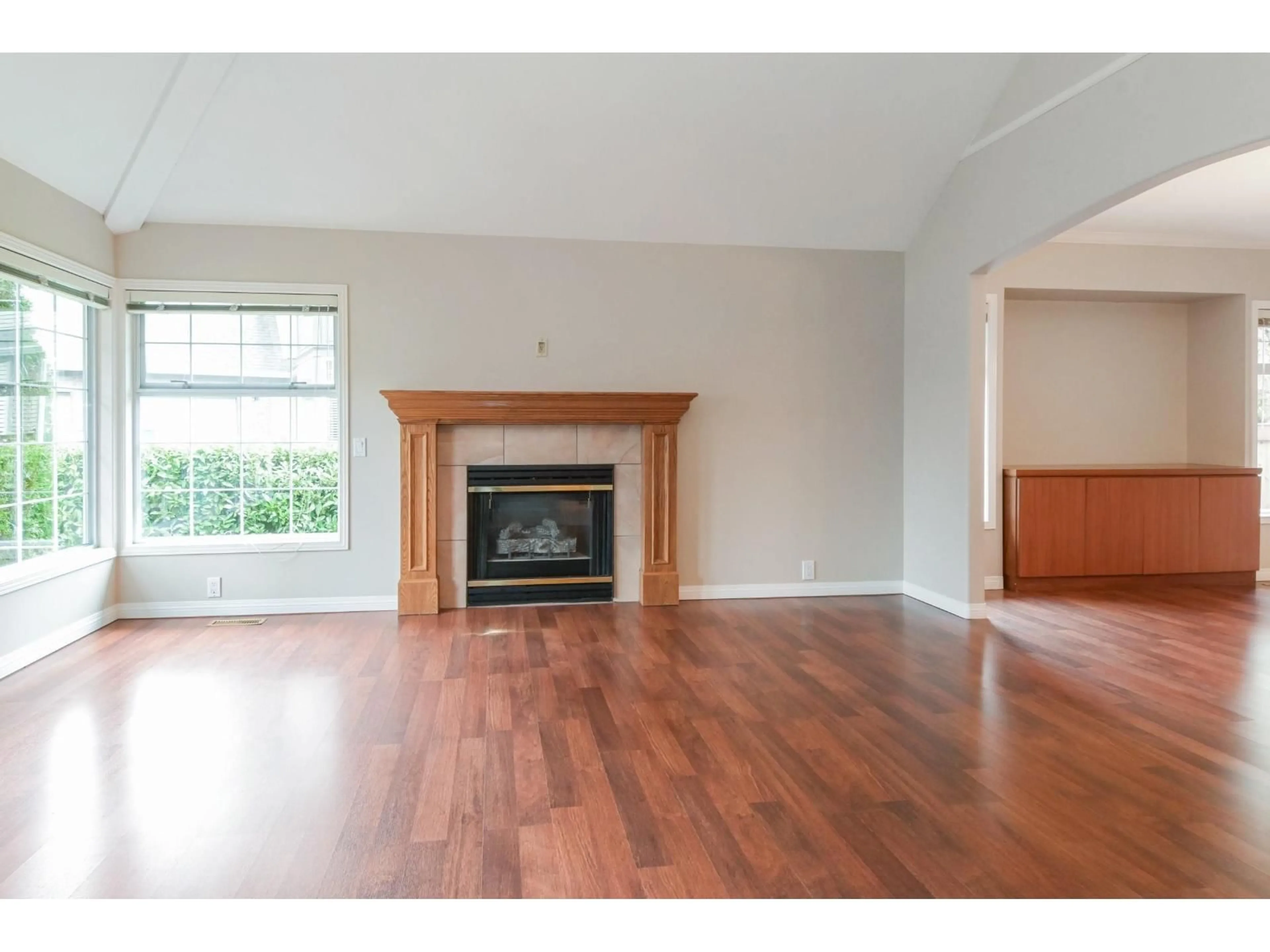 Living room with furniture, wood/laminate floor for 9740 210 STREET, Langley British Columbia V1M2P8