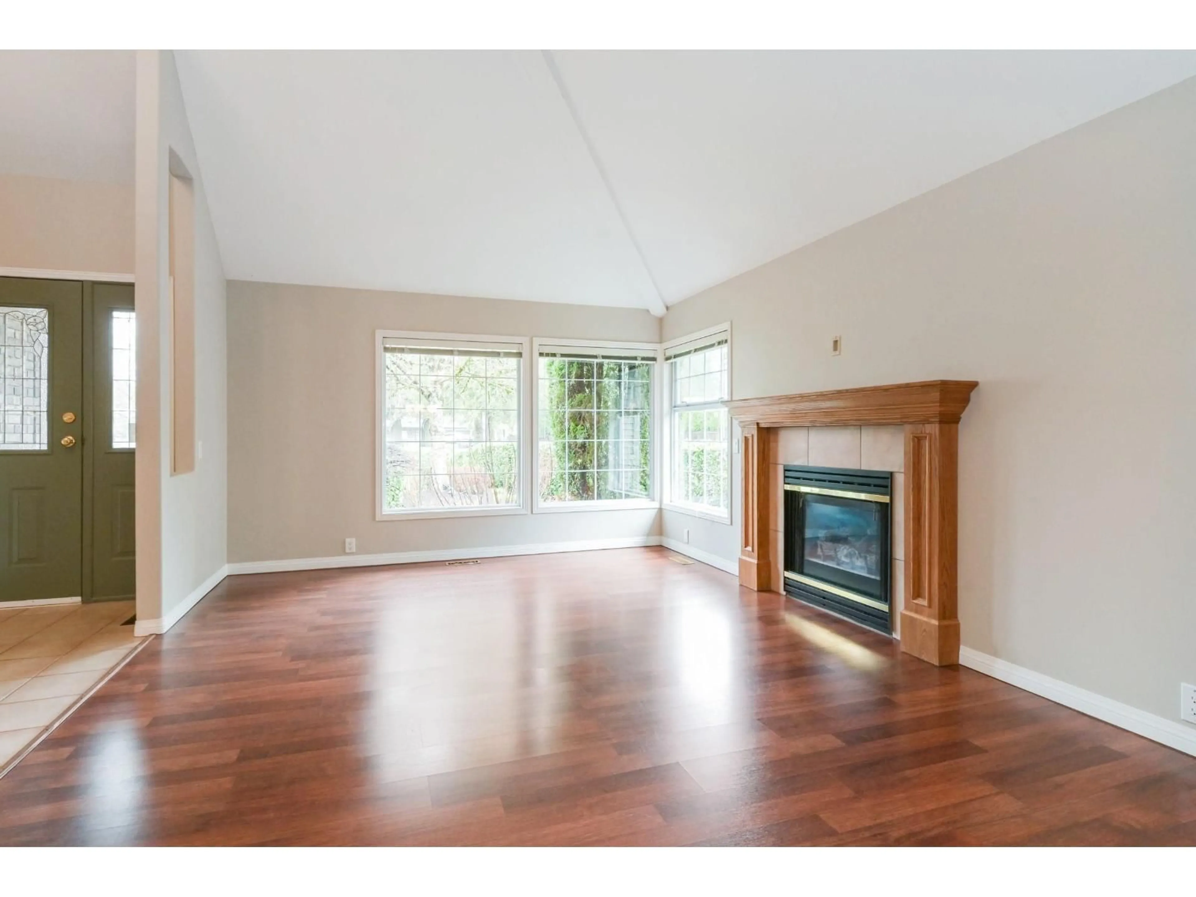 Living room with furniture, wood/laminate floor for 9740 210 STREET, Langley British Columbia V1M2P8
