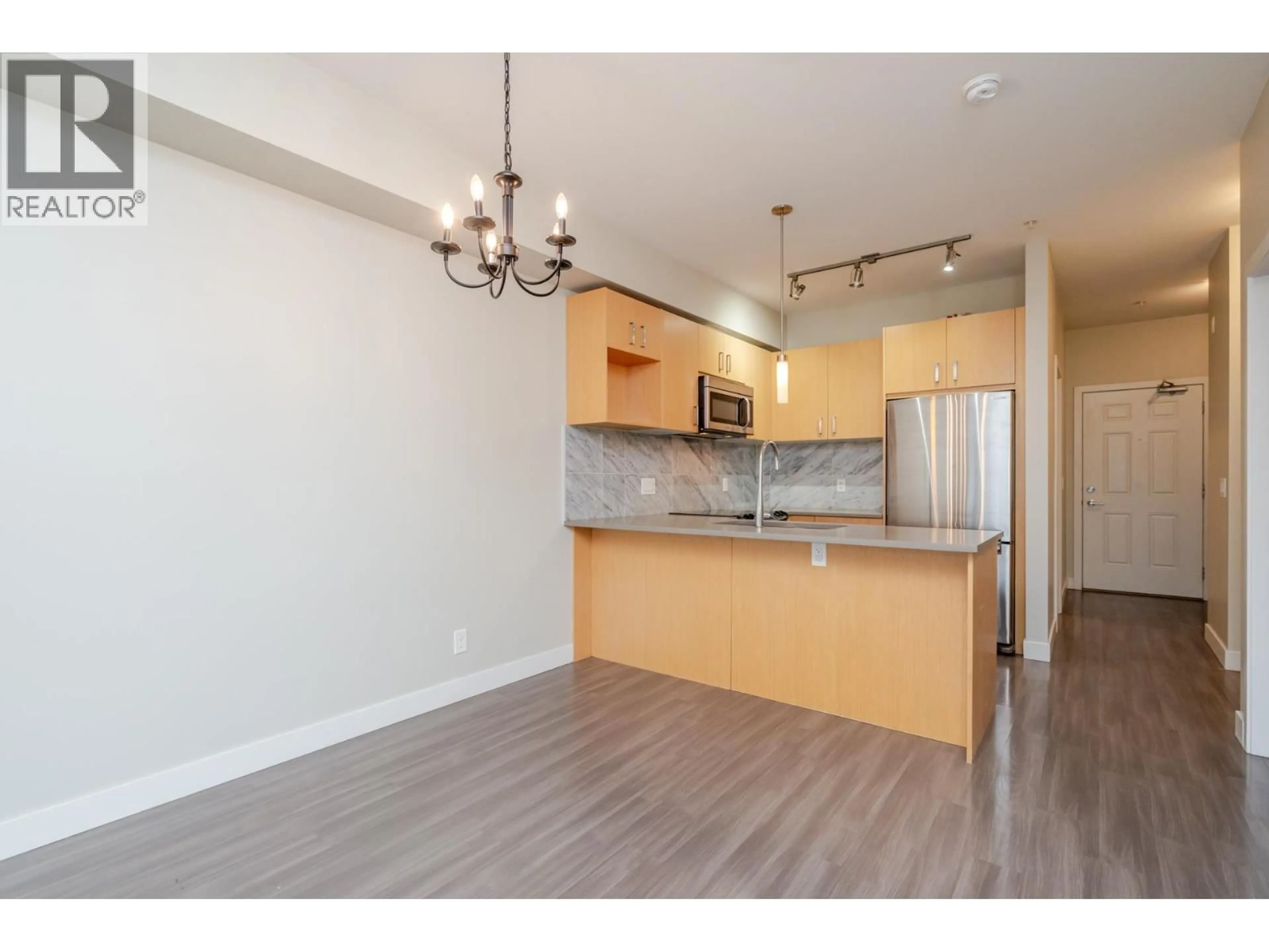 Open concept kitchen, wood/laminate floor for 204 - 12040 222 STREET, Maple Ridge British Columbia V2X5W1