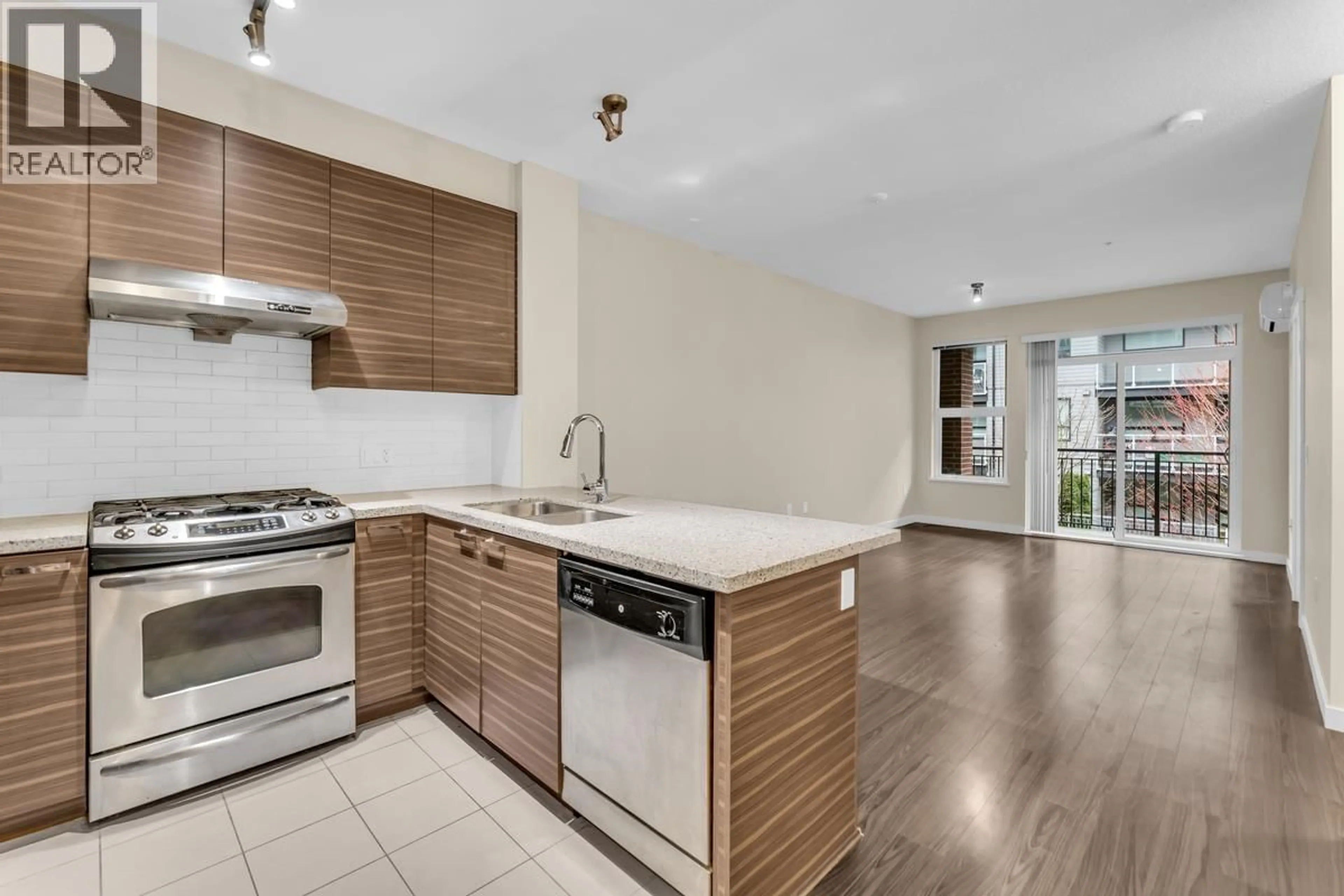 Open concept kitchen, wood/laminate floor for 233 - 9399 ODLIN ROAD, Richmond British Columbia V6X0J6