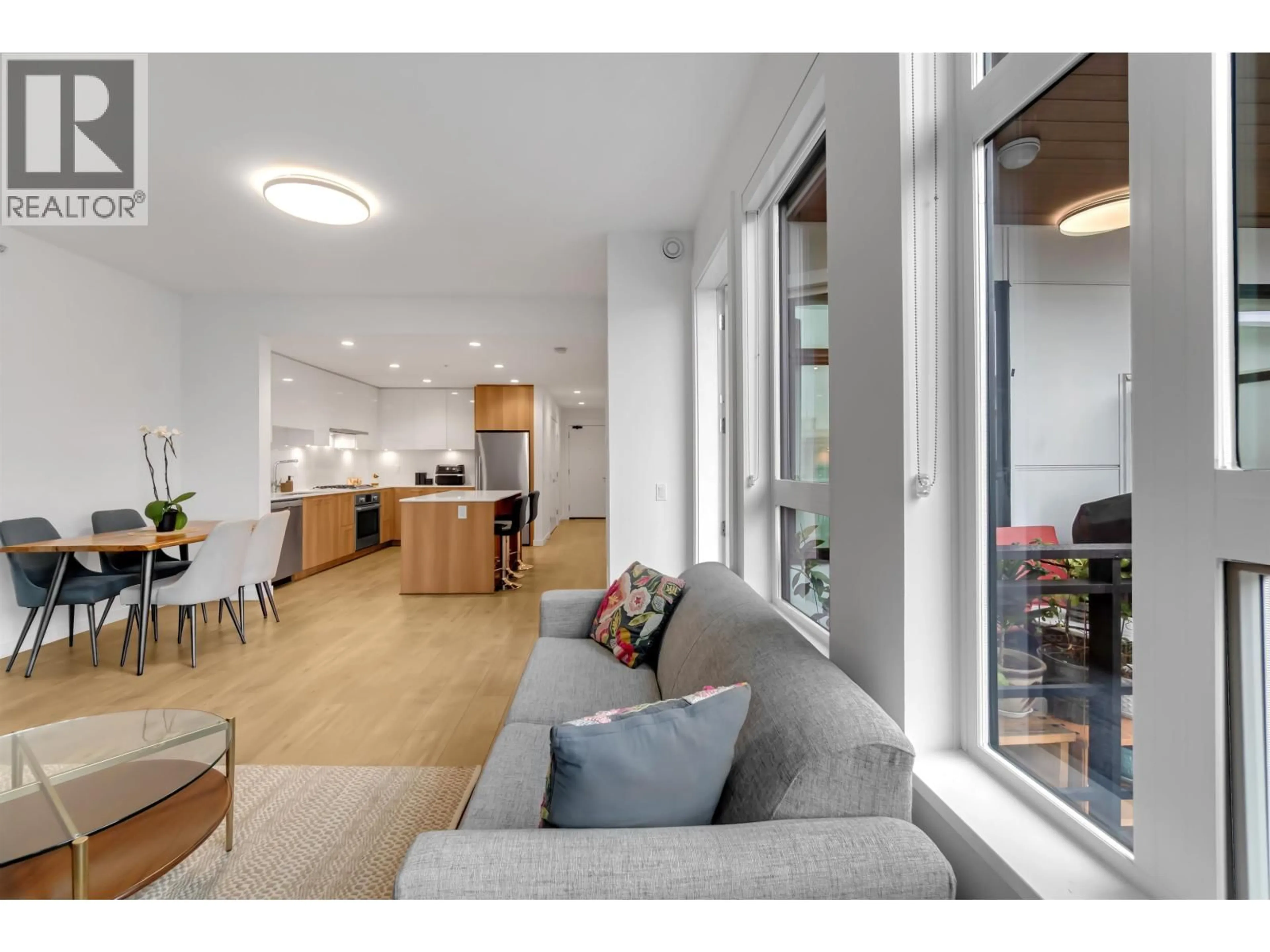 Living room with furniture, unknown for 303 - 715 15 STREET, North Vancouver British Columbia V7M1T2