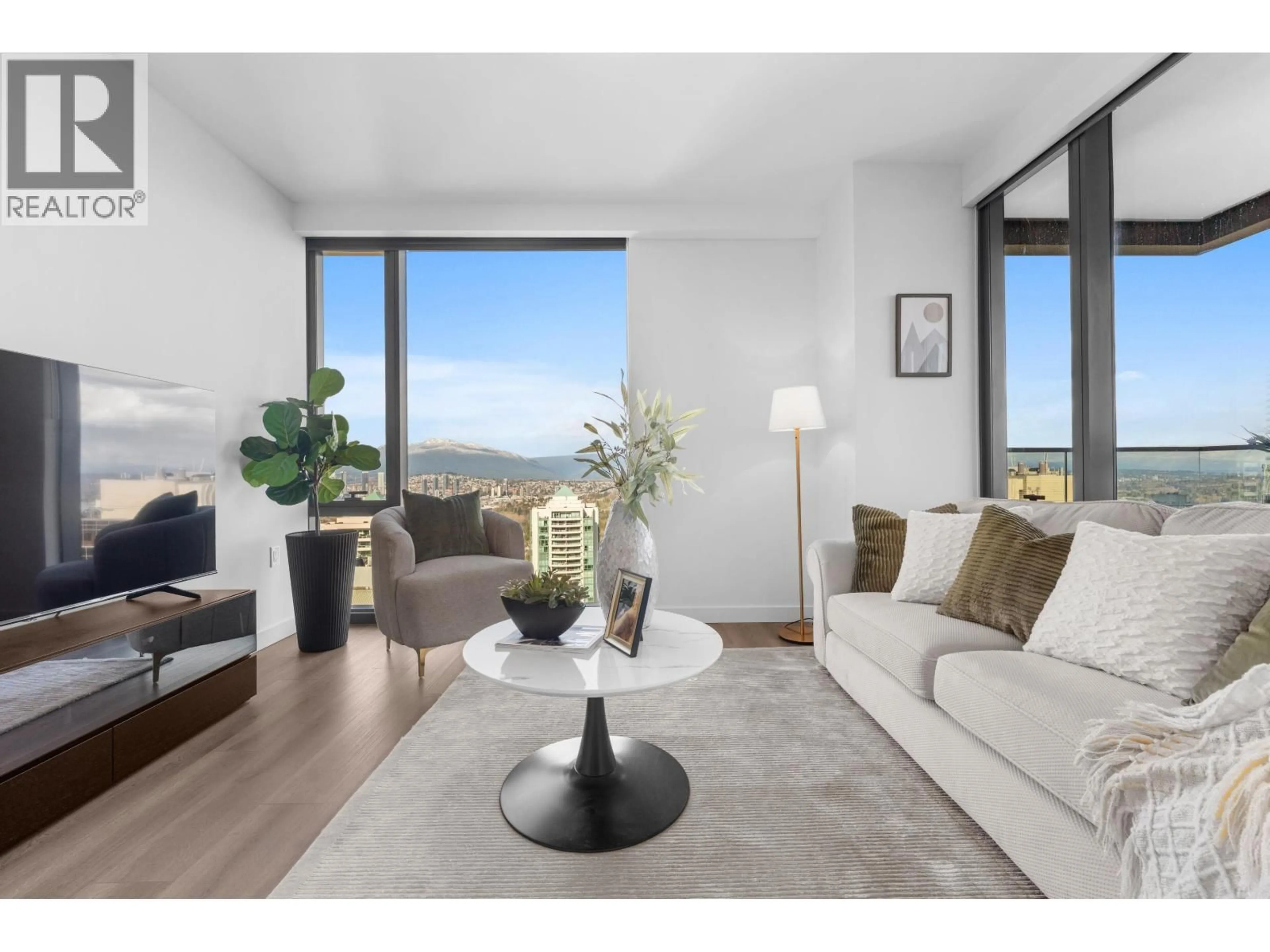 Living room with furniture, wood/laminate floor for 2108 - 5987 WILSON AVENUE, Burnaby British Columbia V5H0L7