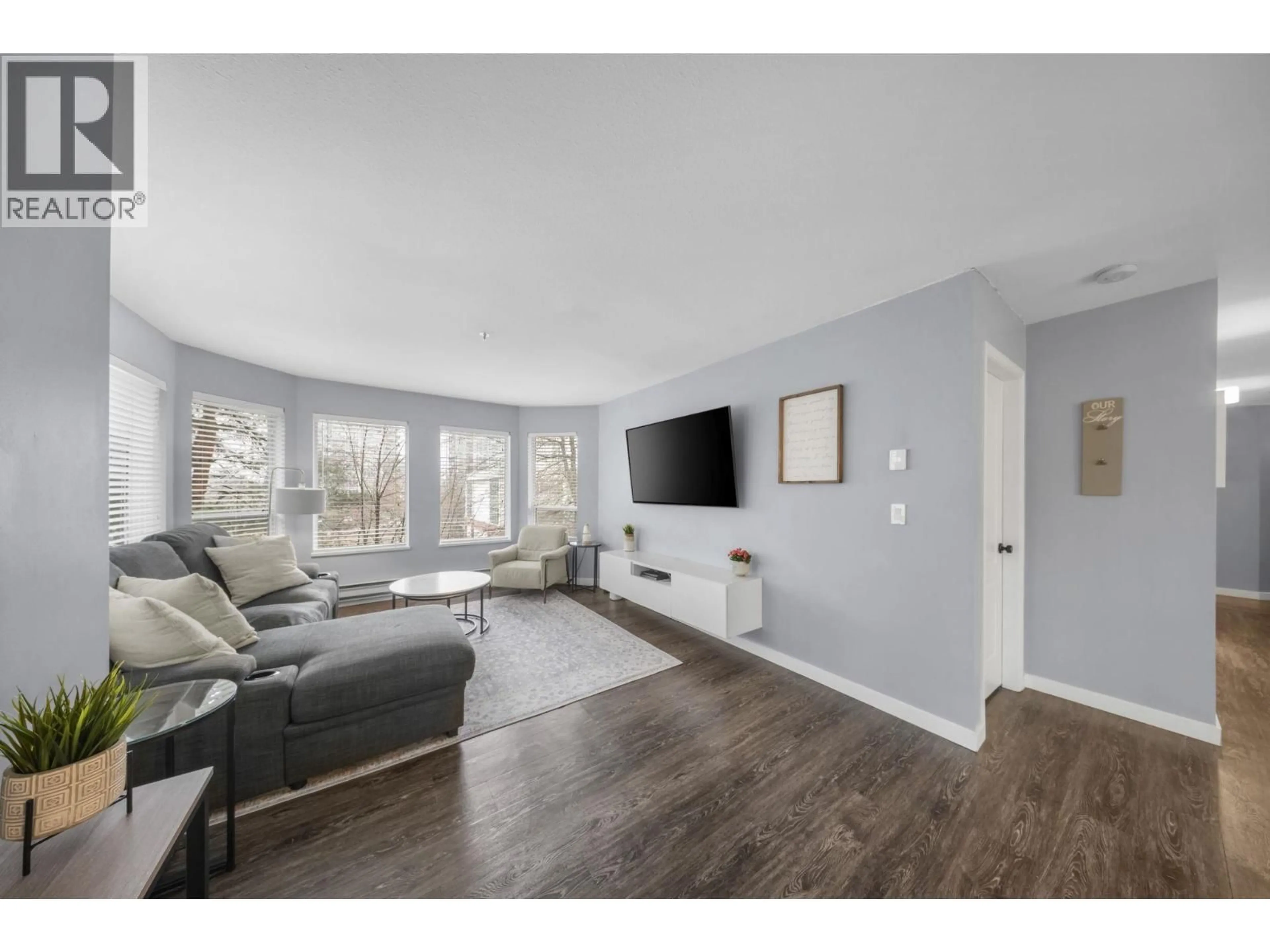 Living room with furniture, wood/laminate floor for 306 - 19236 FORD ROAD, Pitt Meadows British Columbia V3Y2K1