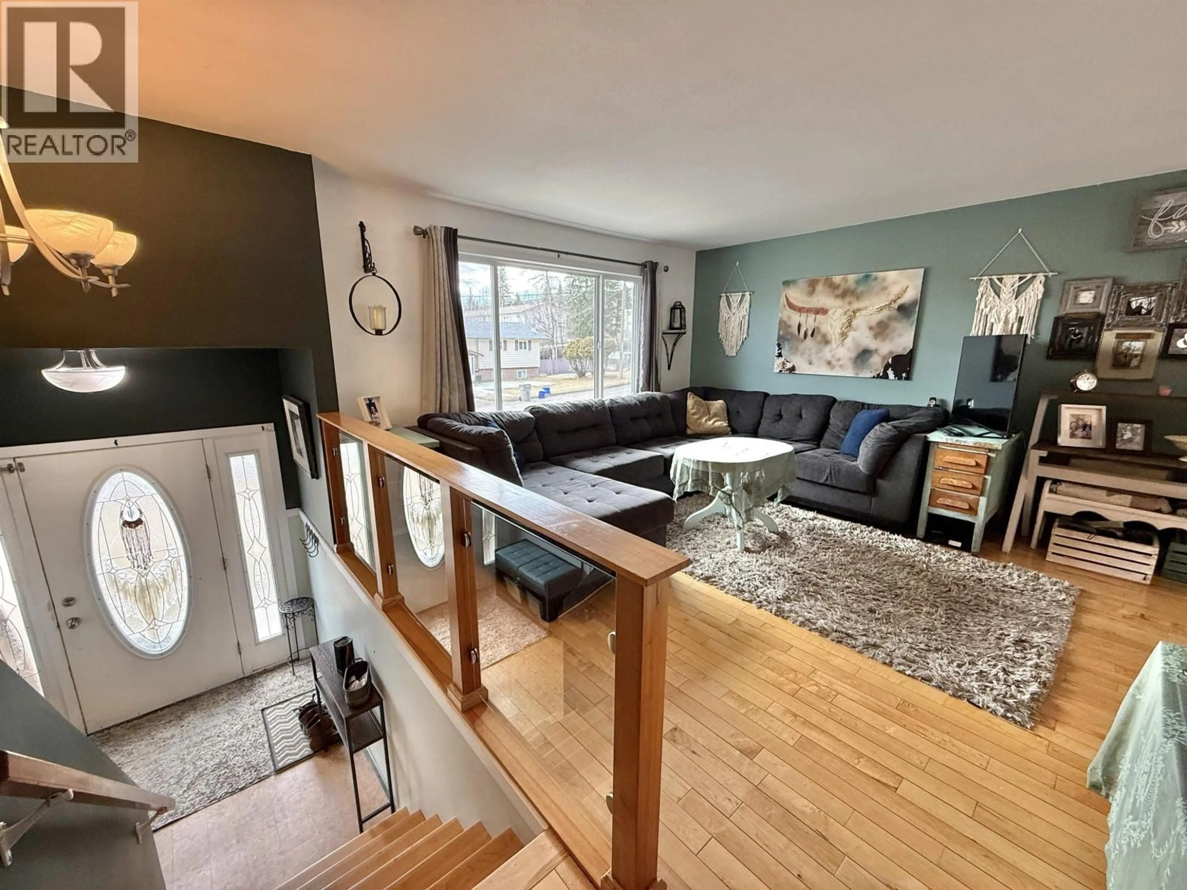 Living room with furniture, wood/laminate floor for 1167 PURMAL AVENUE, Quesnel British Columbia V2J4T3