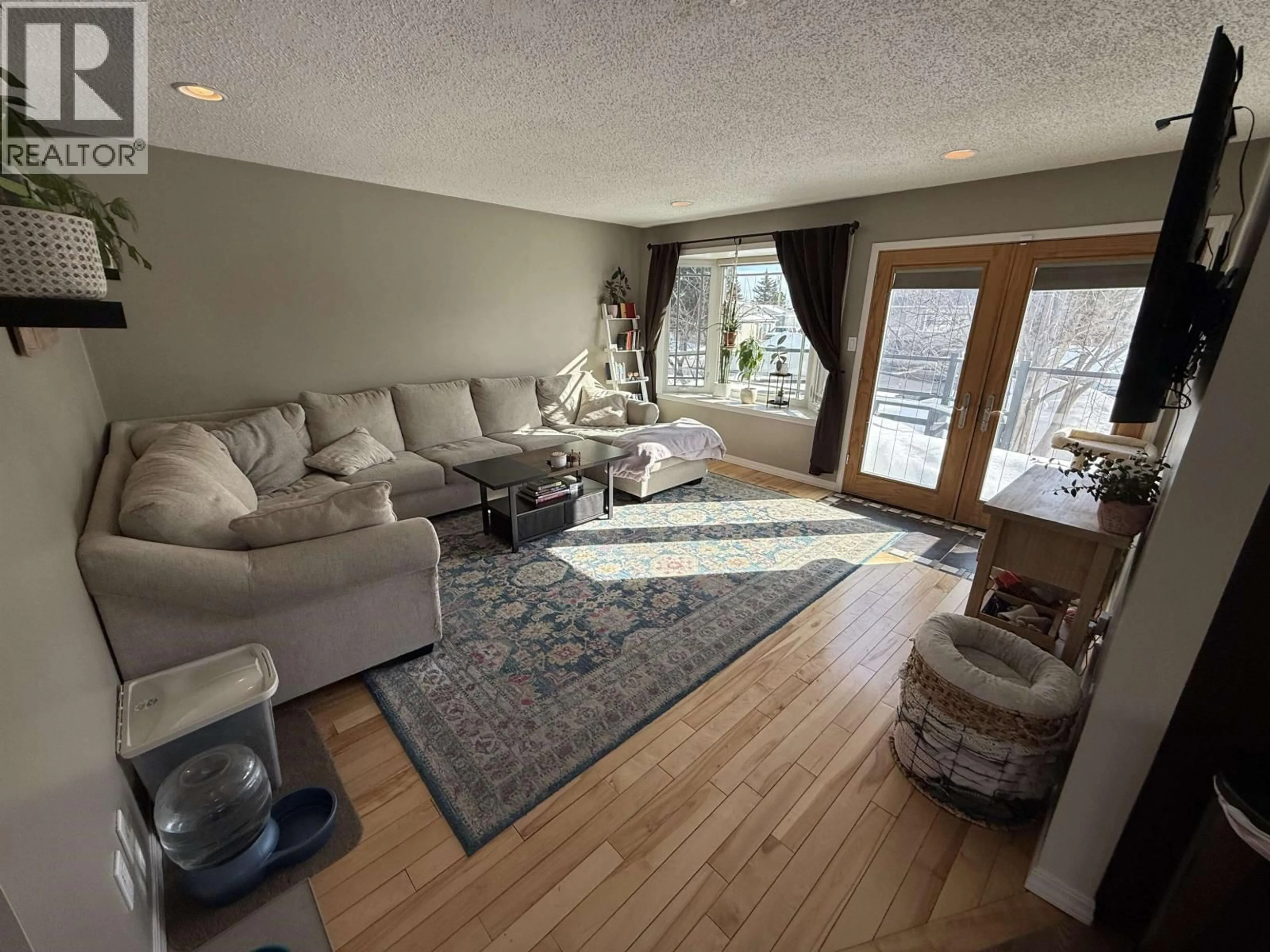 Living room with furniture, unknown for 8508 97 AVENUE, Fort St. John British Columbia V1J1M4