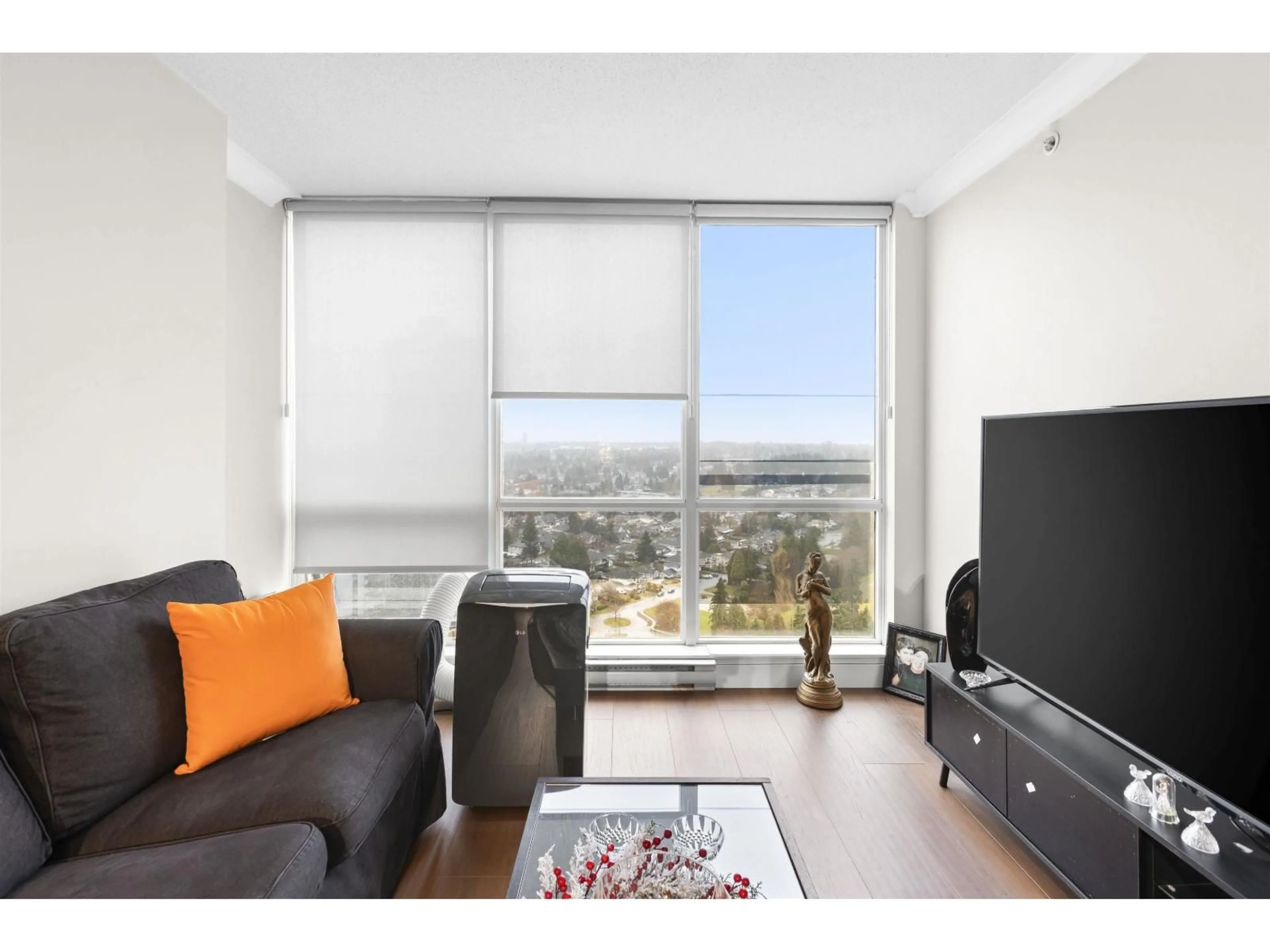 Living room with furniture, wood/laminate floor for 3001 - 13618 100 AVENUE, Surrey British Columbia V3T0A8