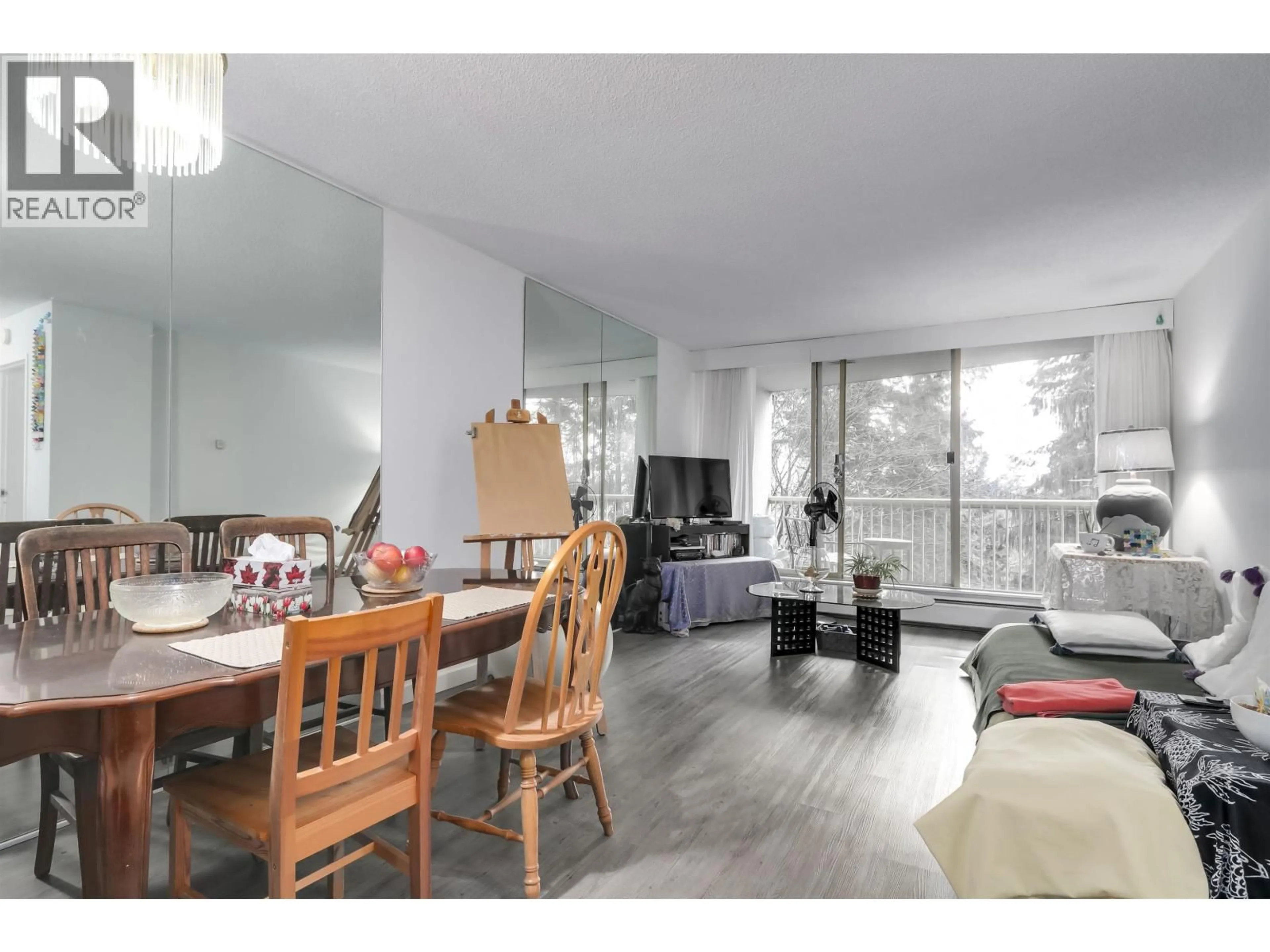 Living room with furniture, wood/laminate floor for 402 - 2024 FULLERTON AVENUE, North Vancouver British Columbia V7P3G4