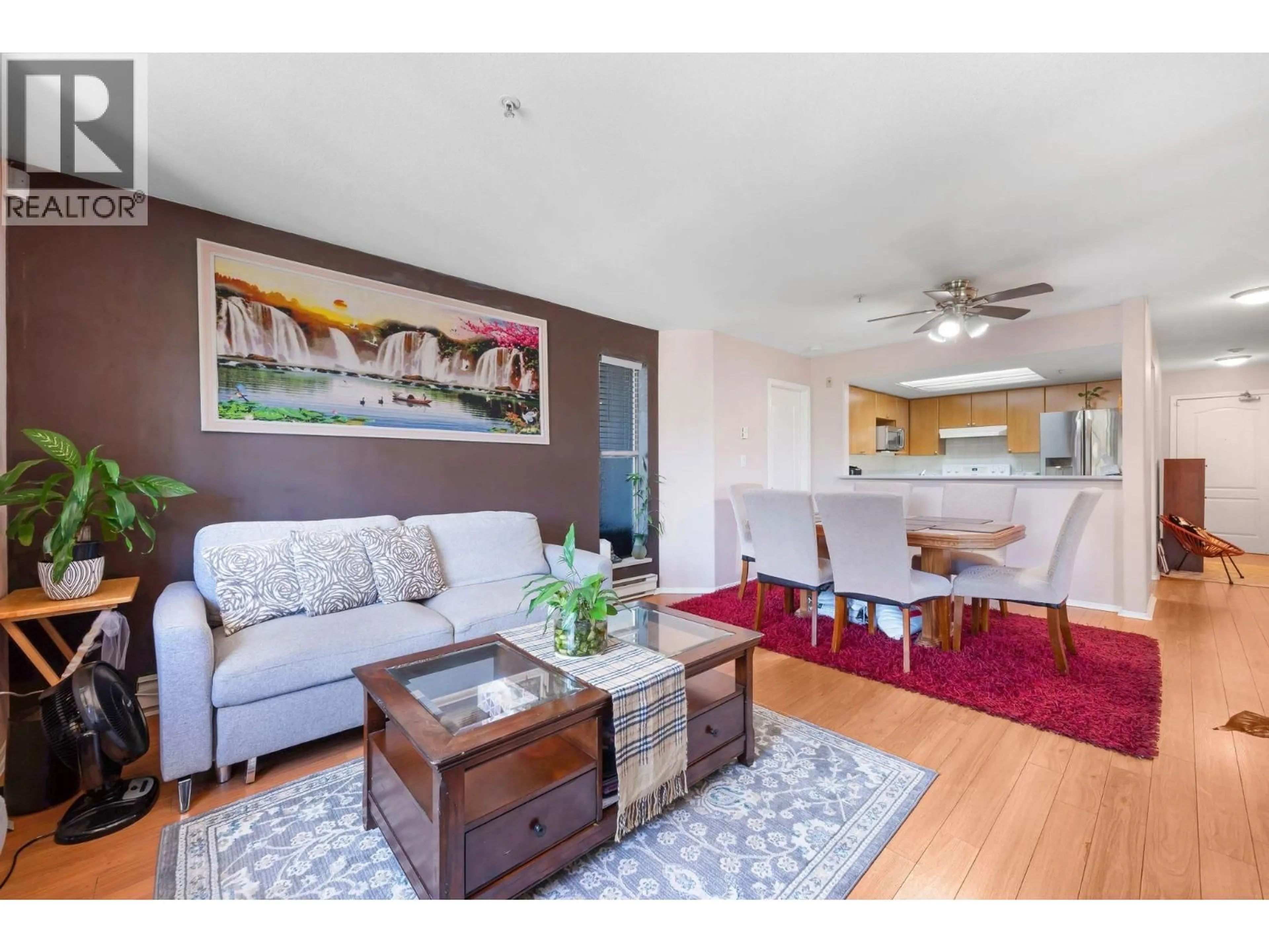 Living room with furniture, wood/laminate floor for 301 - 2360 WILSON AVENUE, Port Coquitlam British Columbia V3C1Z6