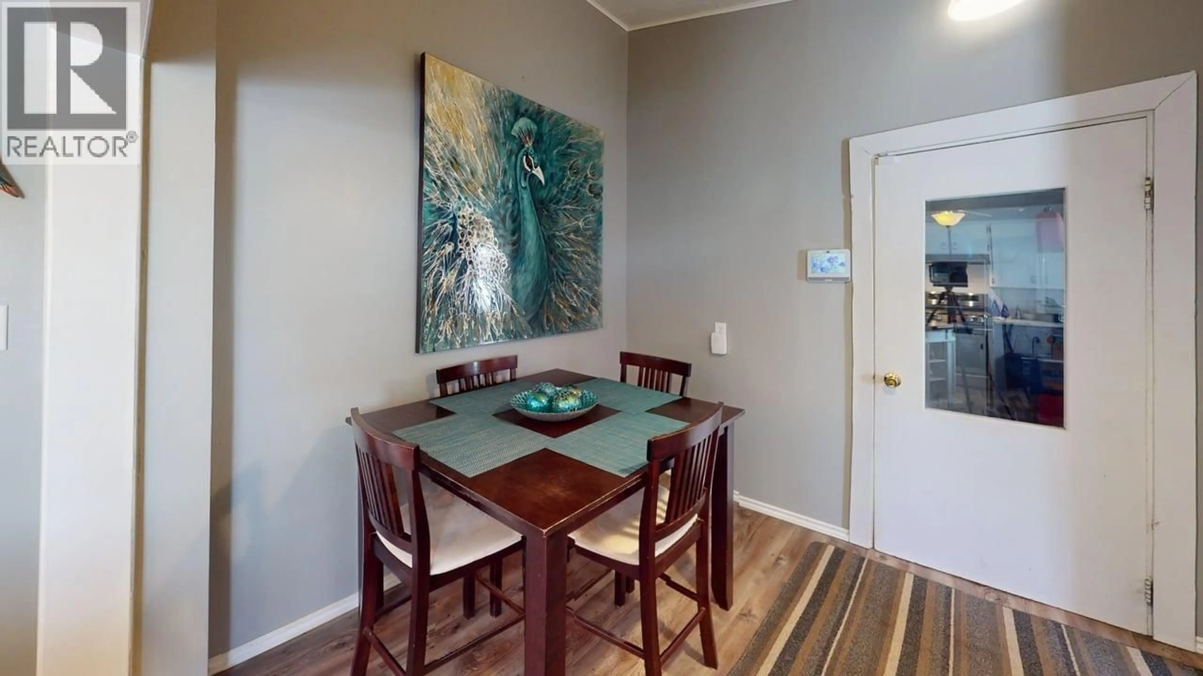 Dining room, wood/laminate floor for 9208 107 AVENUE, Fort St. John British Columbia V1J2P3